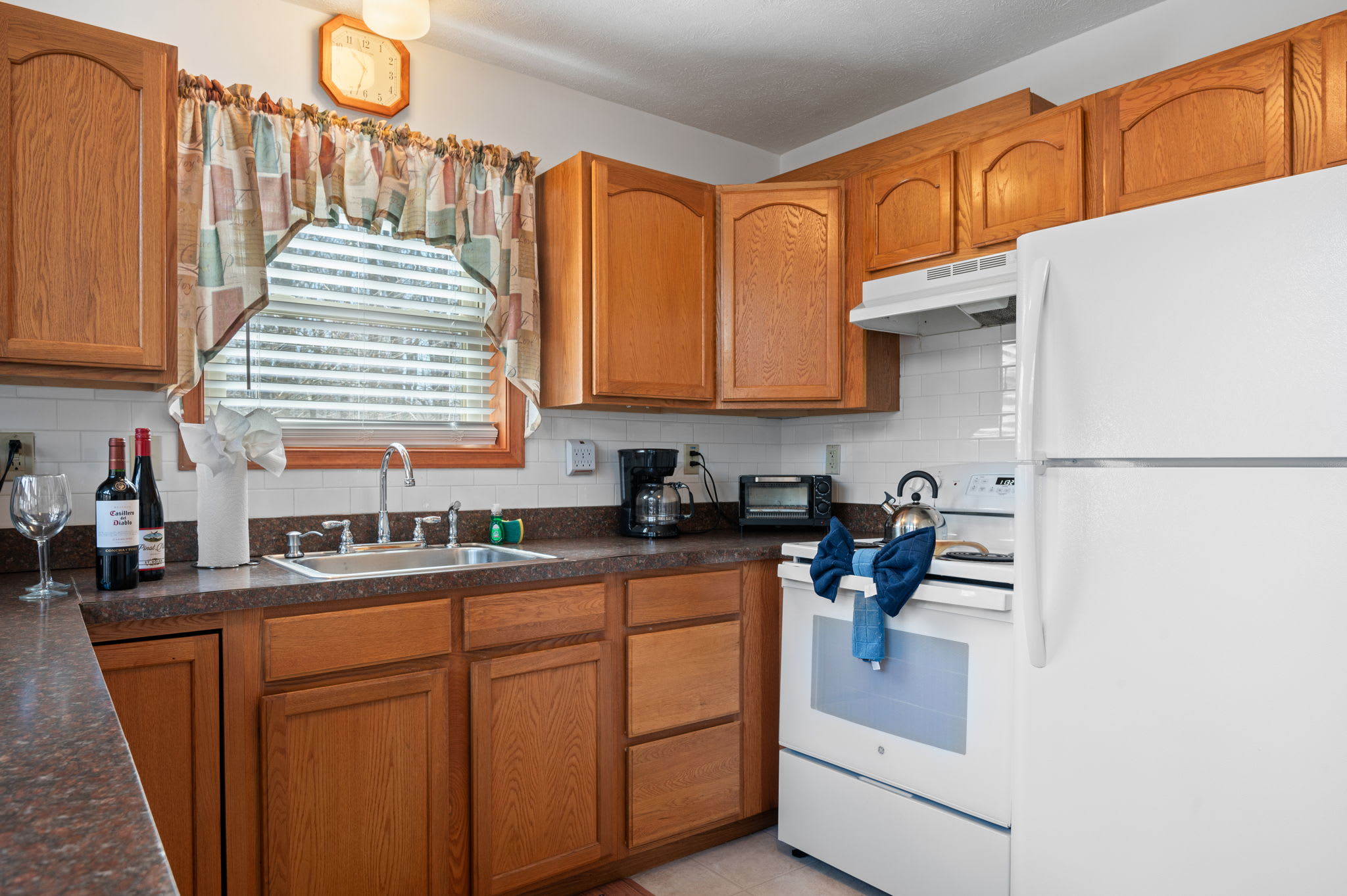Whip up family favorites in the bright kitchen with full-size appliances and ample counter space