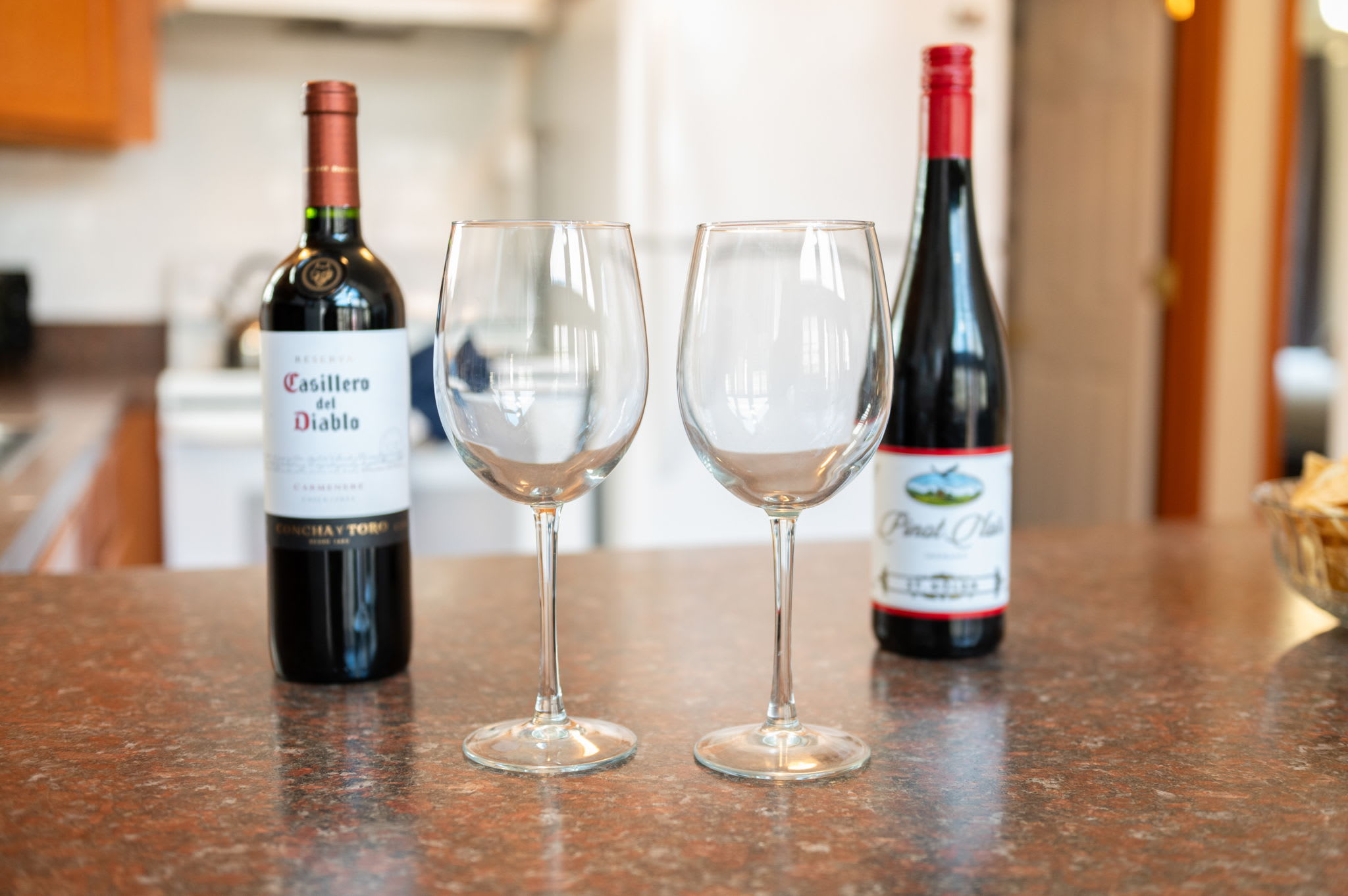 Toast to your vacation with a glass of wine at the rustic dining table