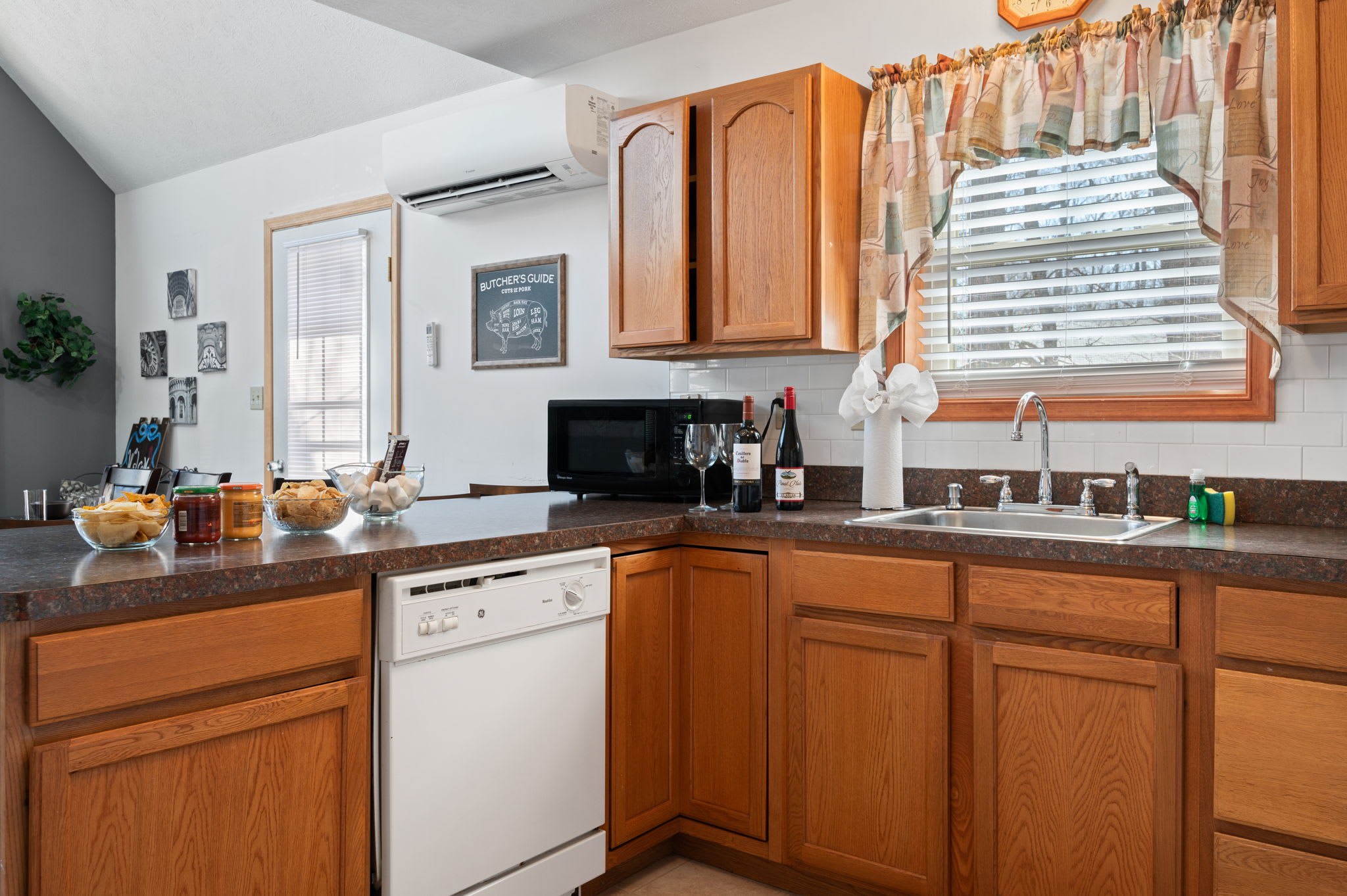 Natural light streams through the kitchen window for a bright and welcoming cooking space