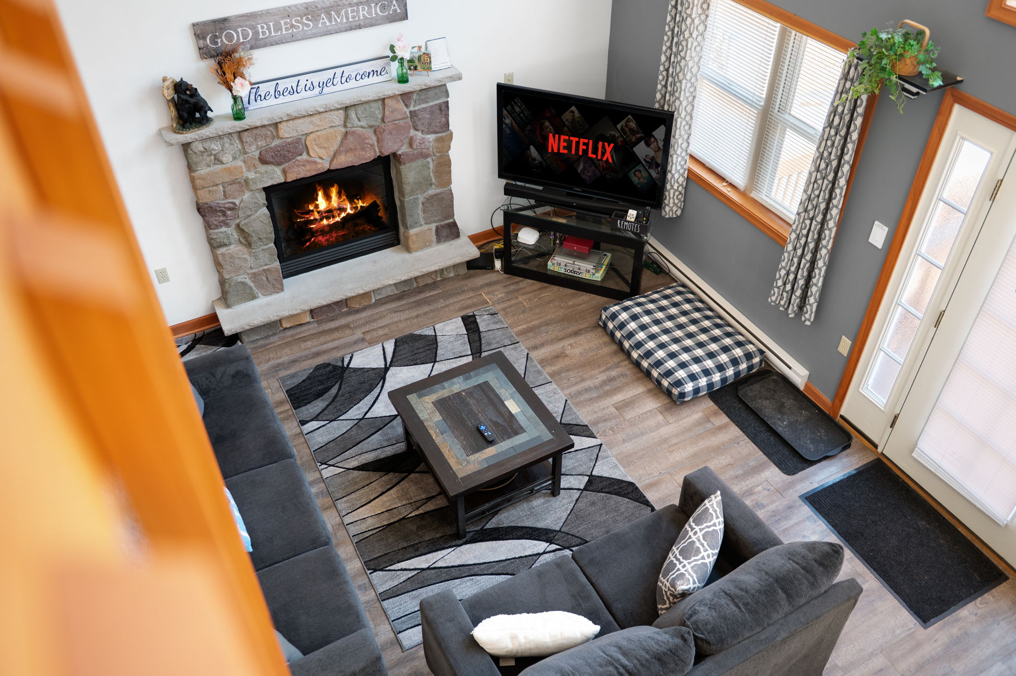 Curl up with a good book by the stone fireplace in this cozy Poconos retreat