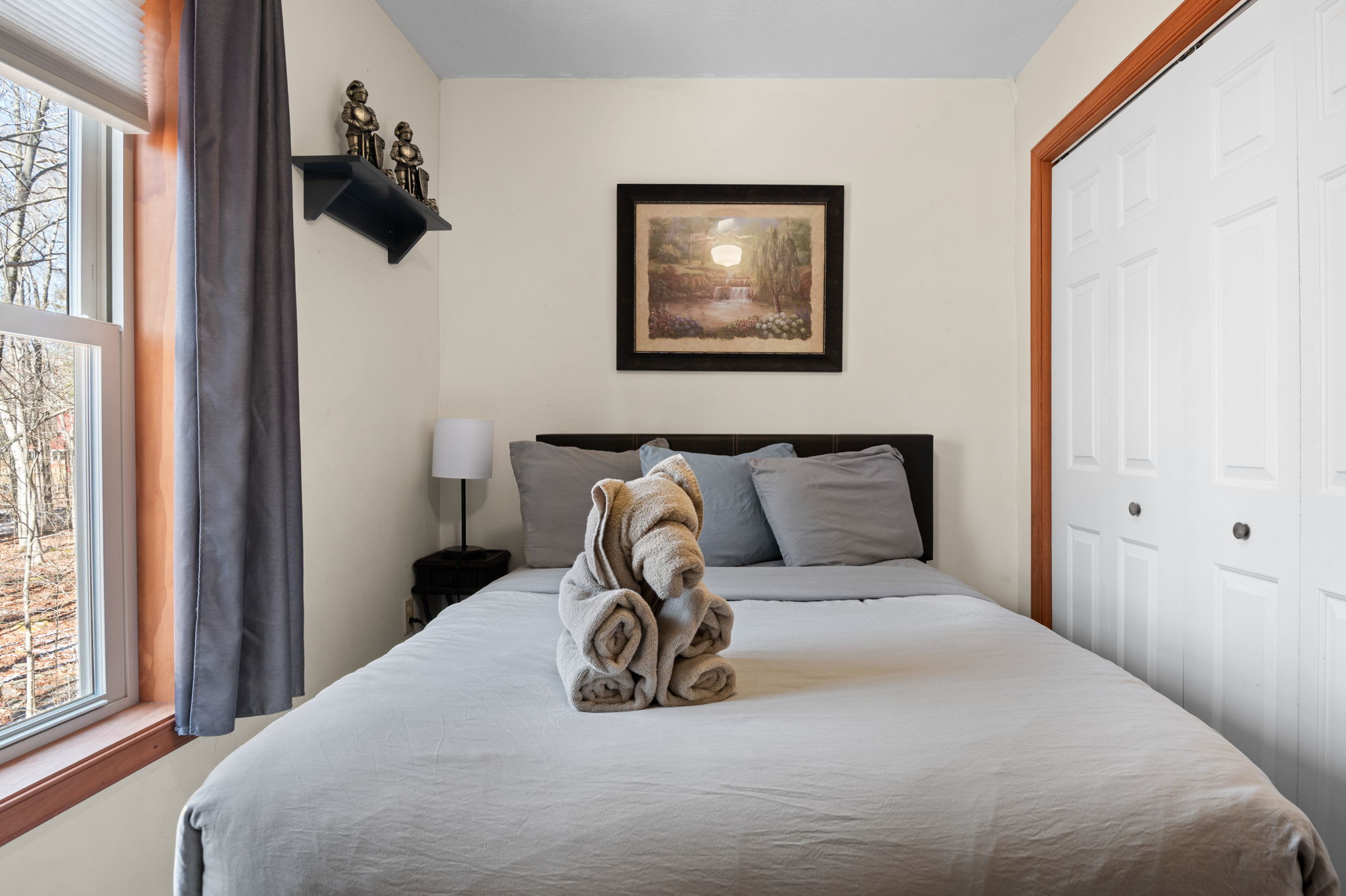 Sink into plush bedding and cozy throws in this inviting queen bedroom retreat