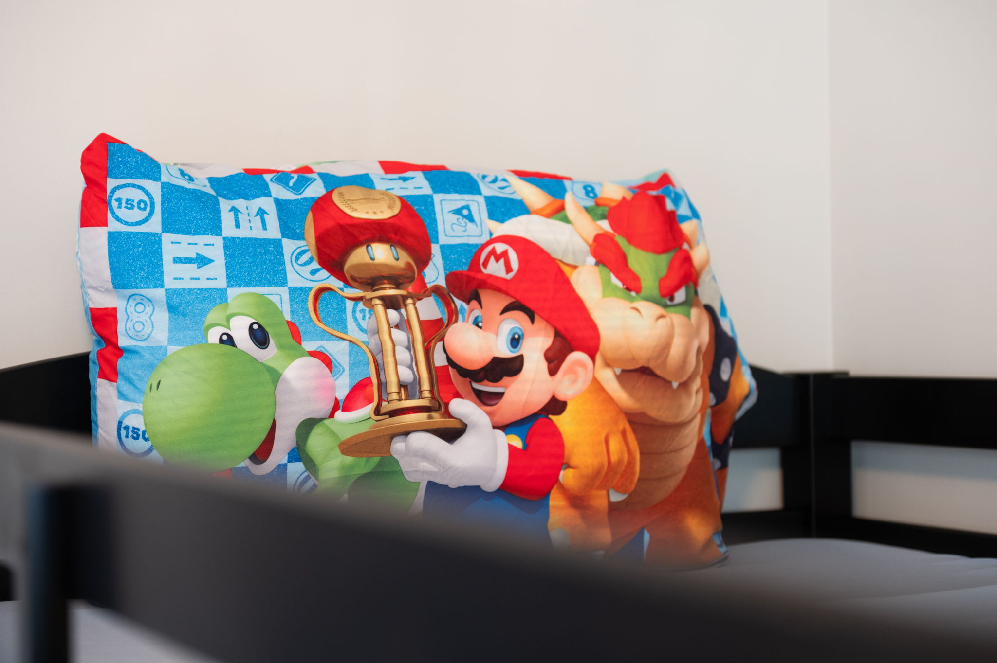 Little ones will love the fun Nintendo-themed bedding on these kid-friendly bunk beds