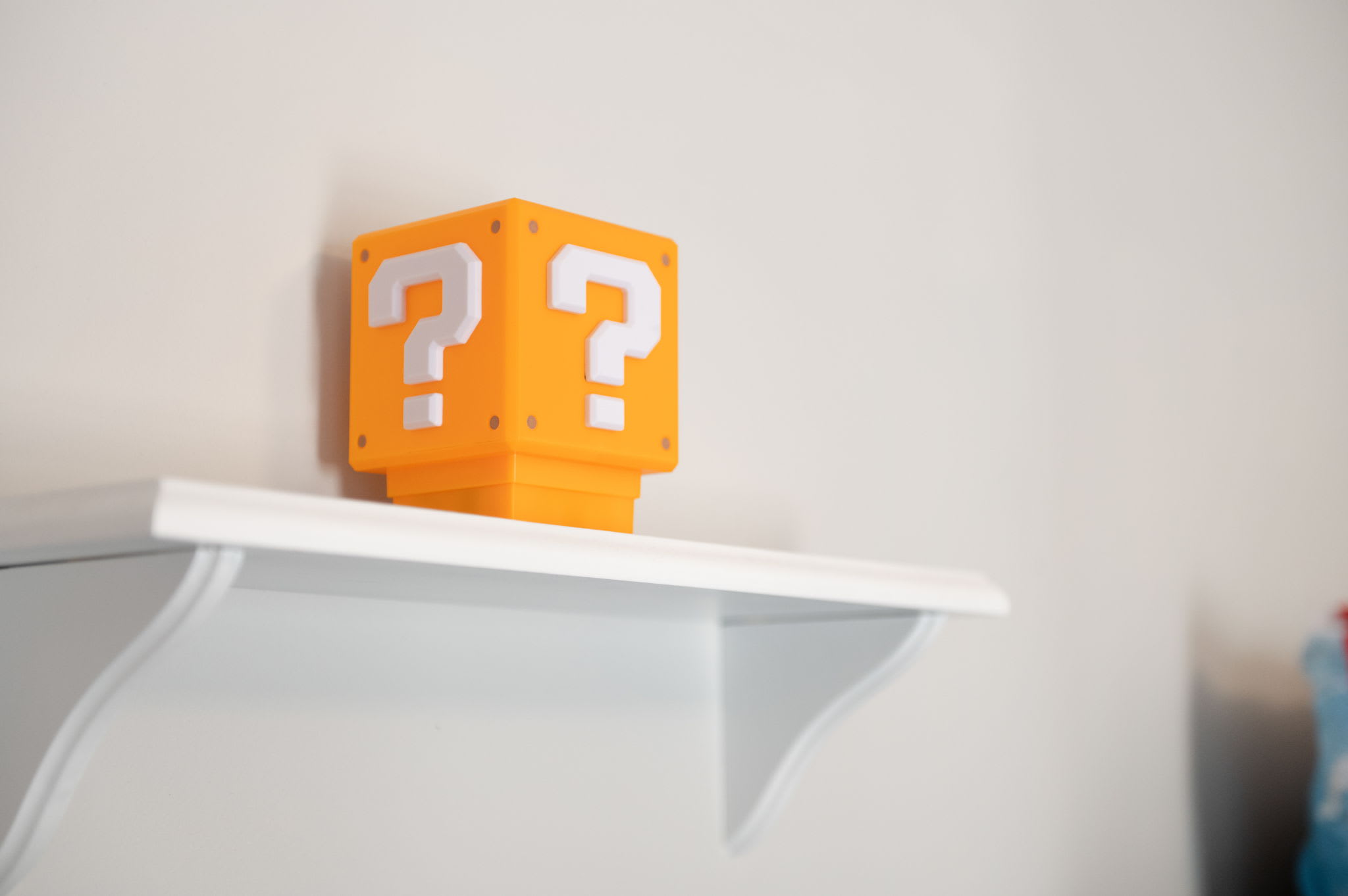 Fun gaming-themed decor adds a playful touch to the bunk room that kids will adore