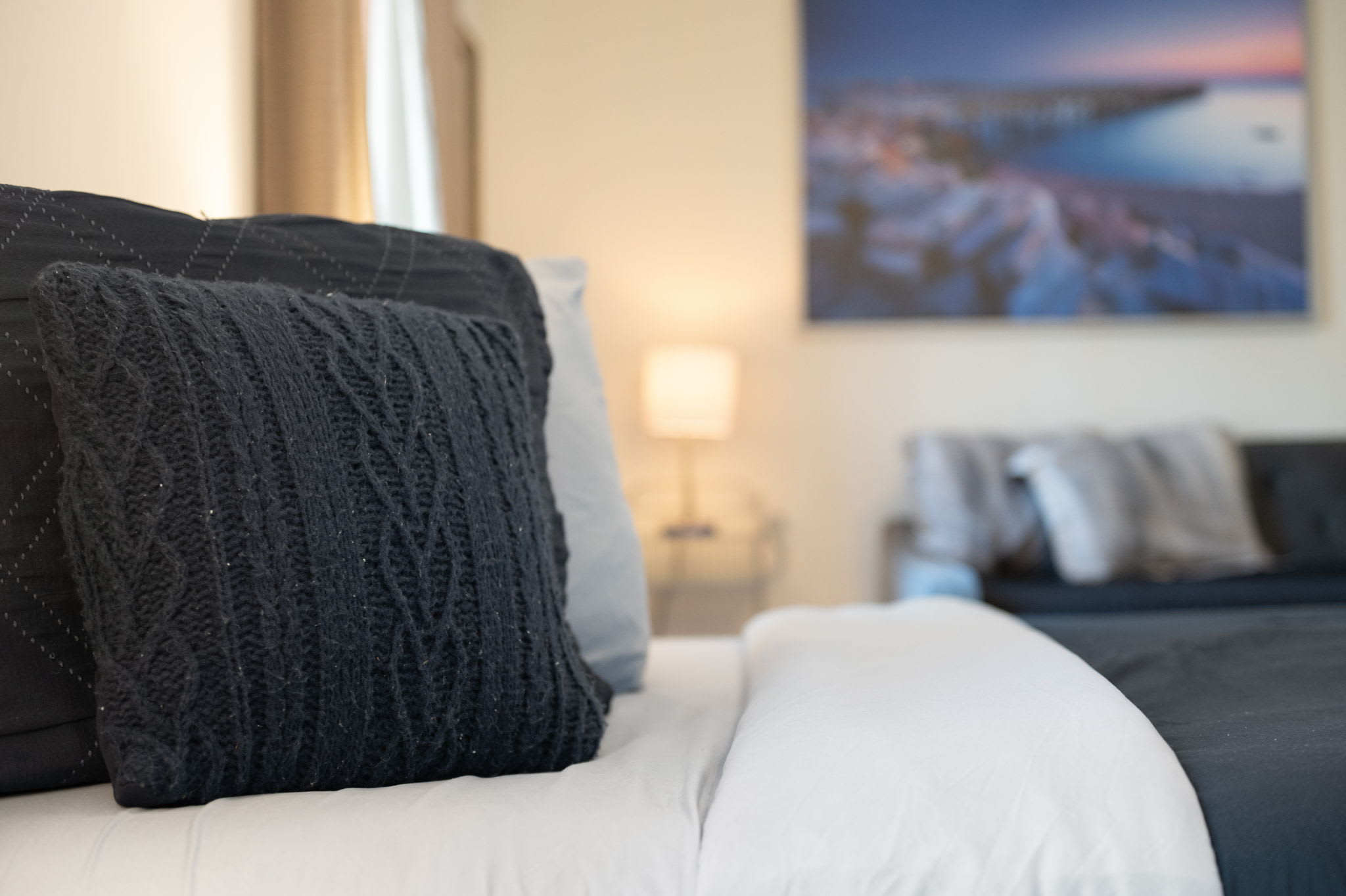 Stylish details and plush pillows make the master bedroom a relaxing retreat