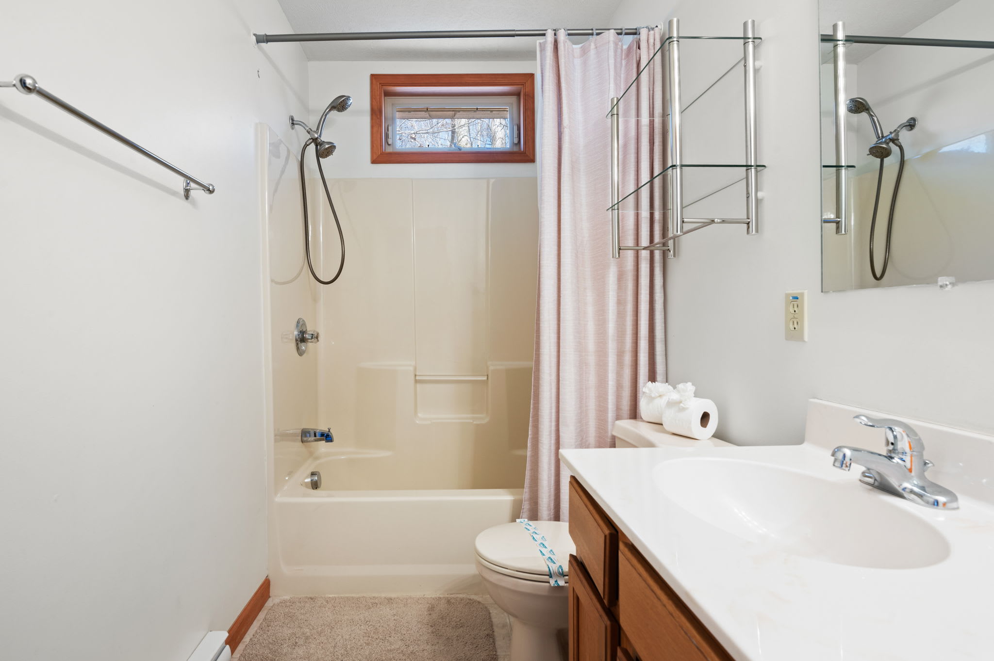 Unwind in the tub-shower combo with convenient glass enclosure and fresh towels