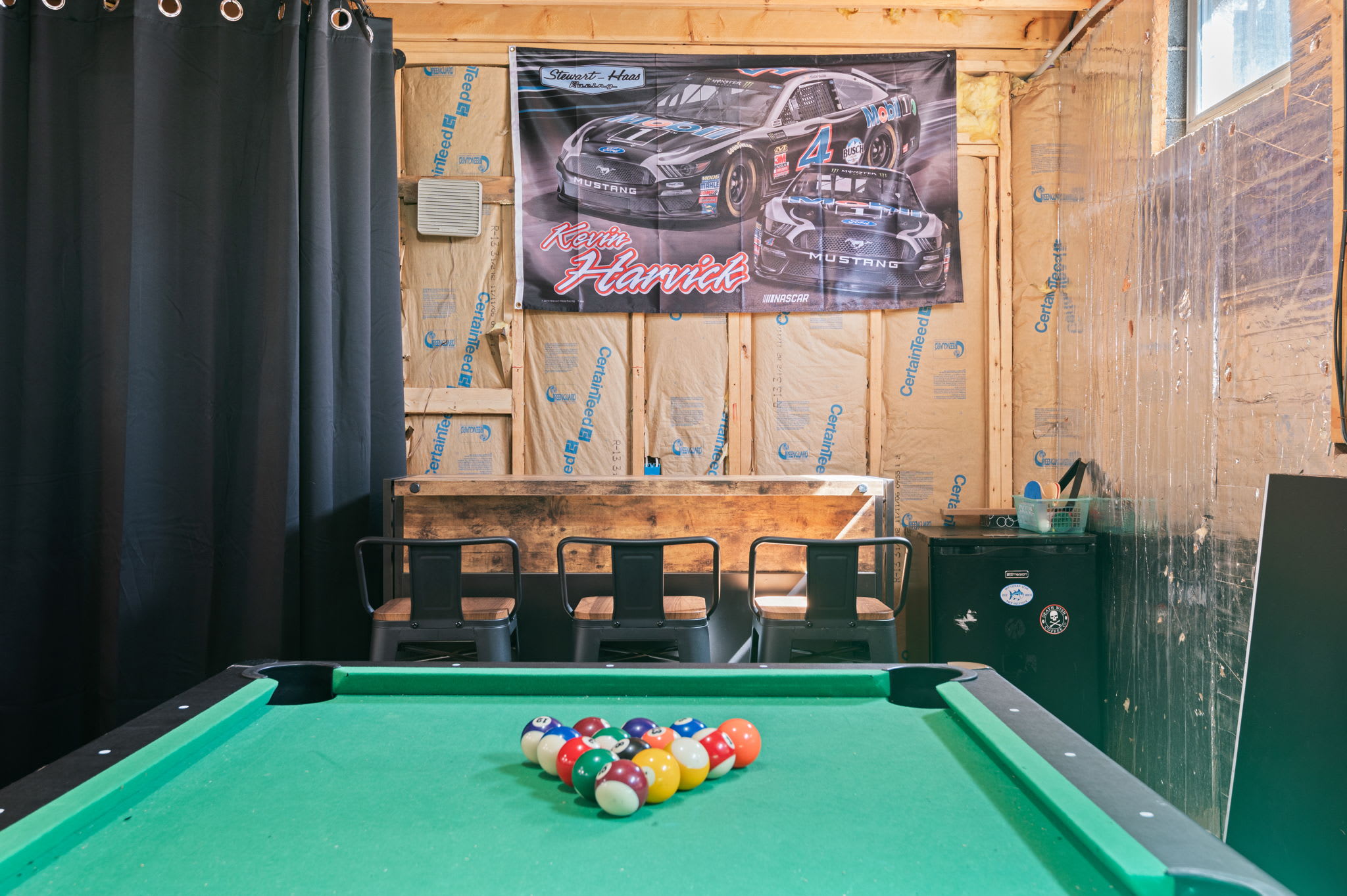 The game room features a regulation pool table for hours of entertainment