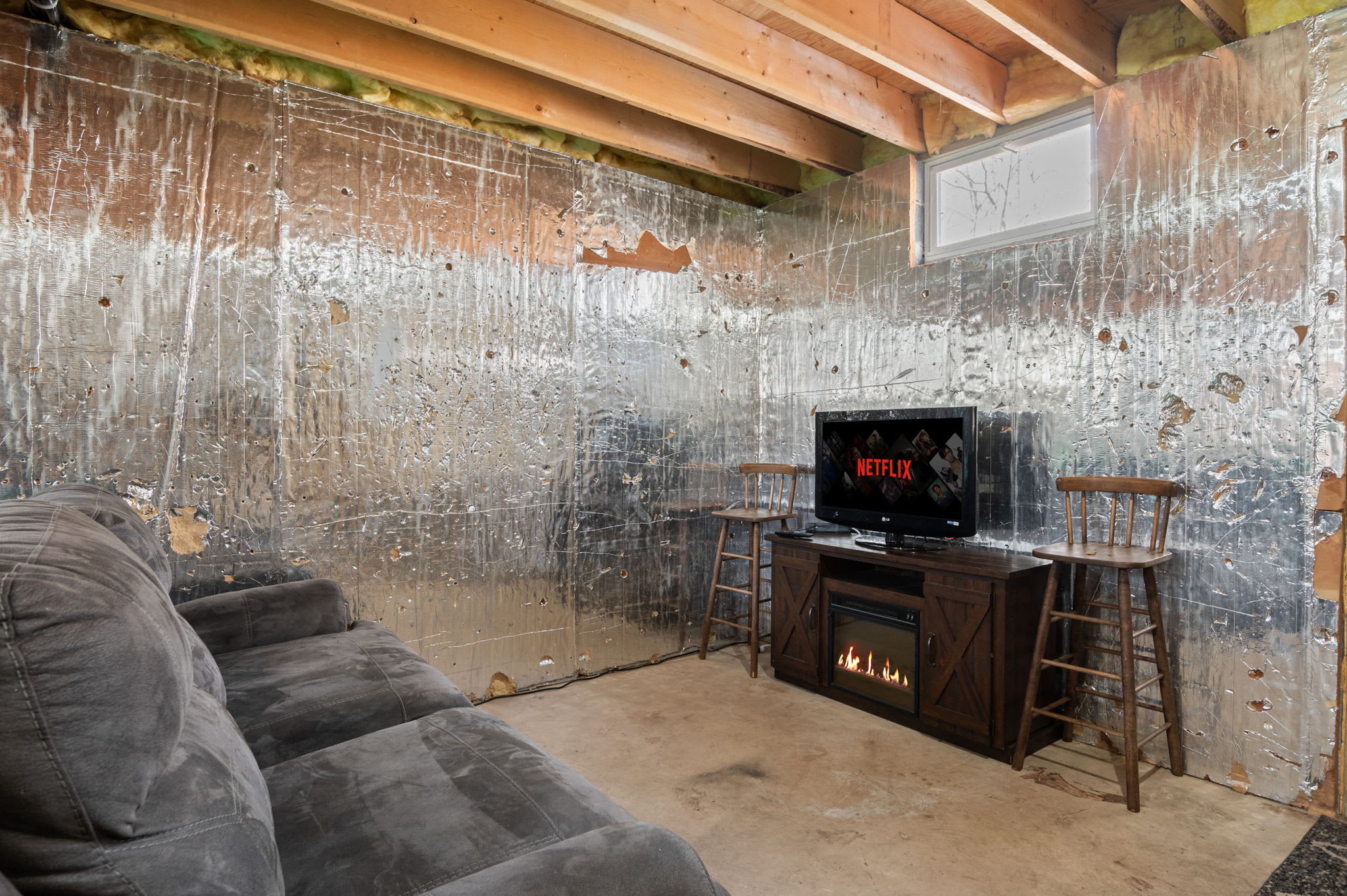 Kick back in the cozy lower level entertainment area with TV and comfortable seating