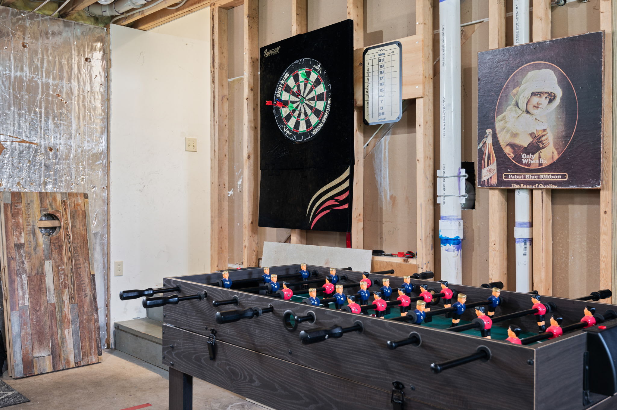 Test your aim at the dartboard or battle it out on the foosball table