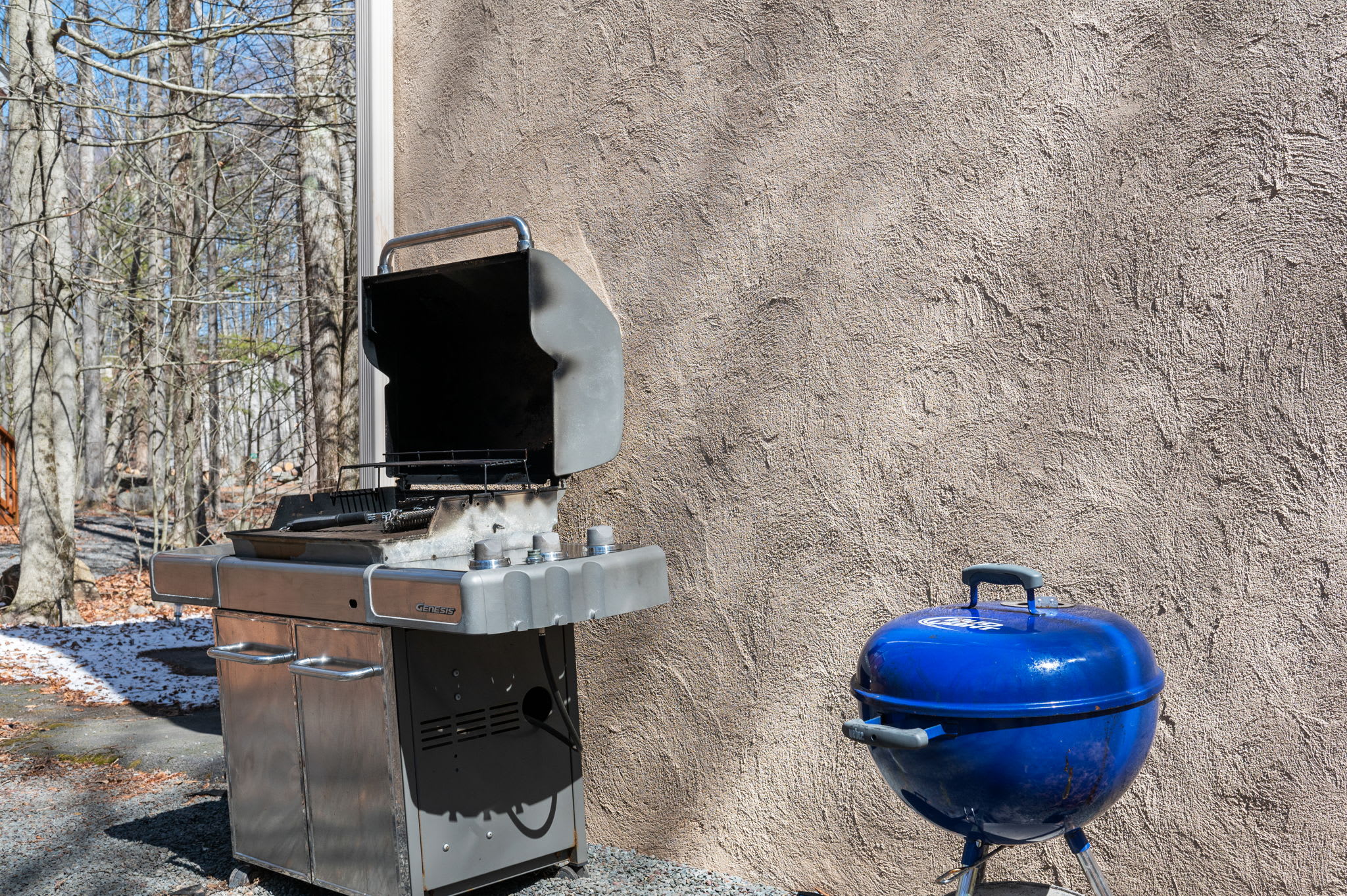 Fire up the outdoor grill station with gas grill and smoker for backyard BBQ fun