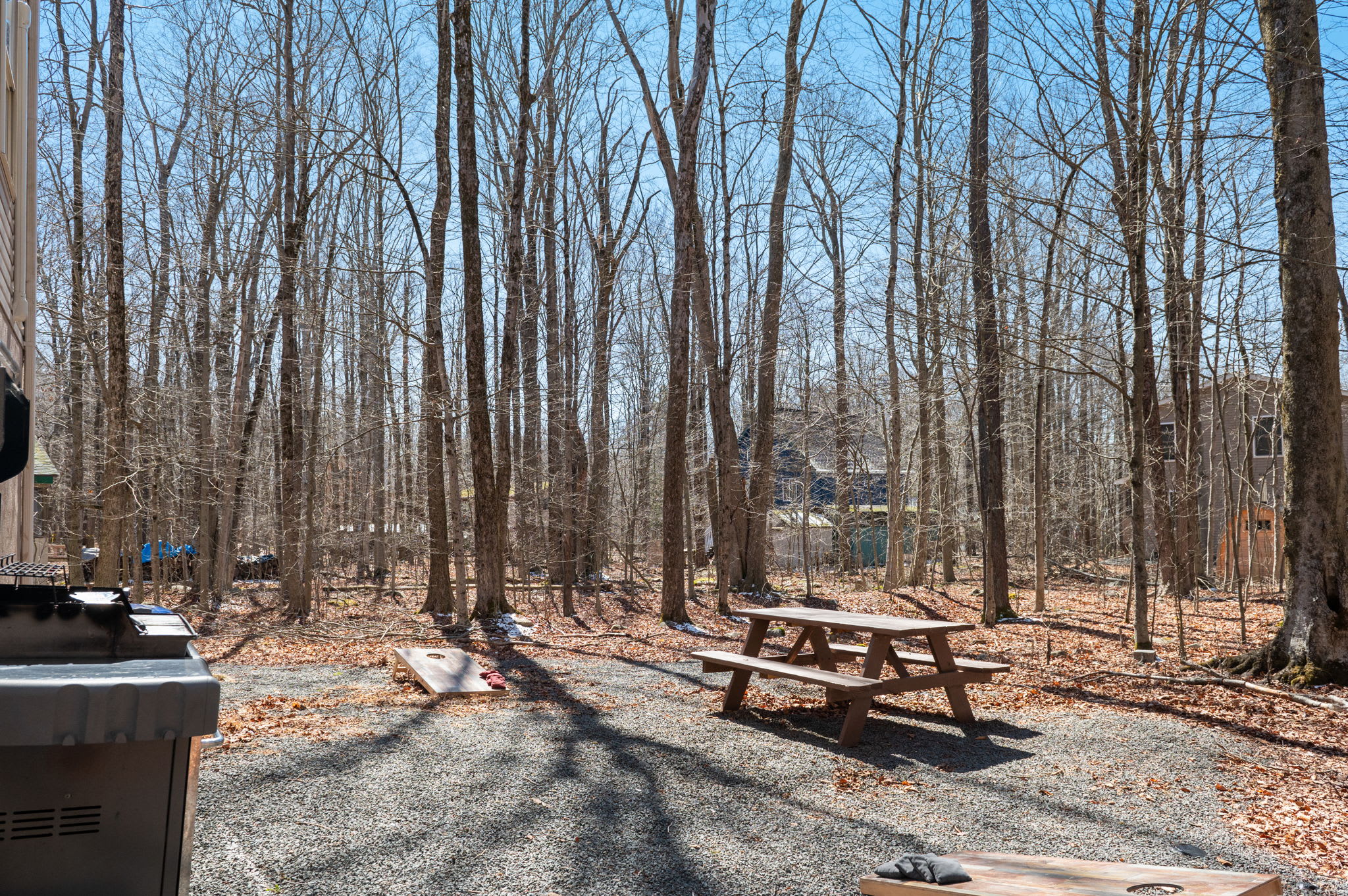 Enjoy outdoor dining at the picnic table surrounded by peaceful Pocono woods