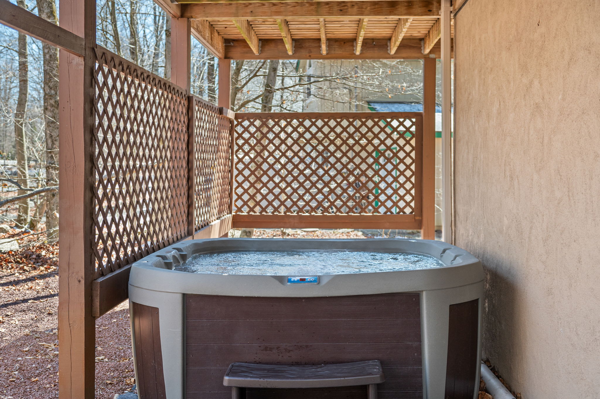 Soak under the stars in the covered hot tub after a day of adventure.