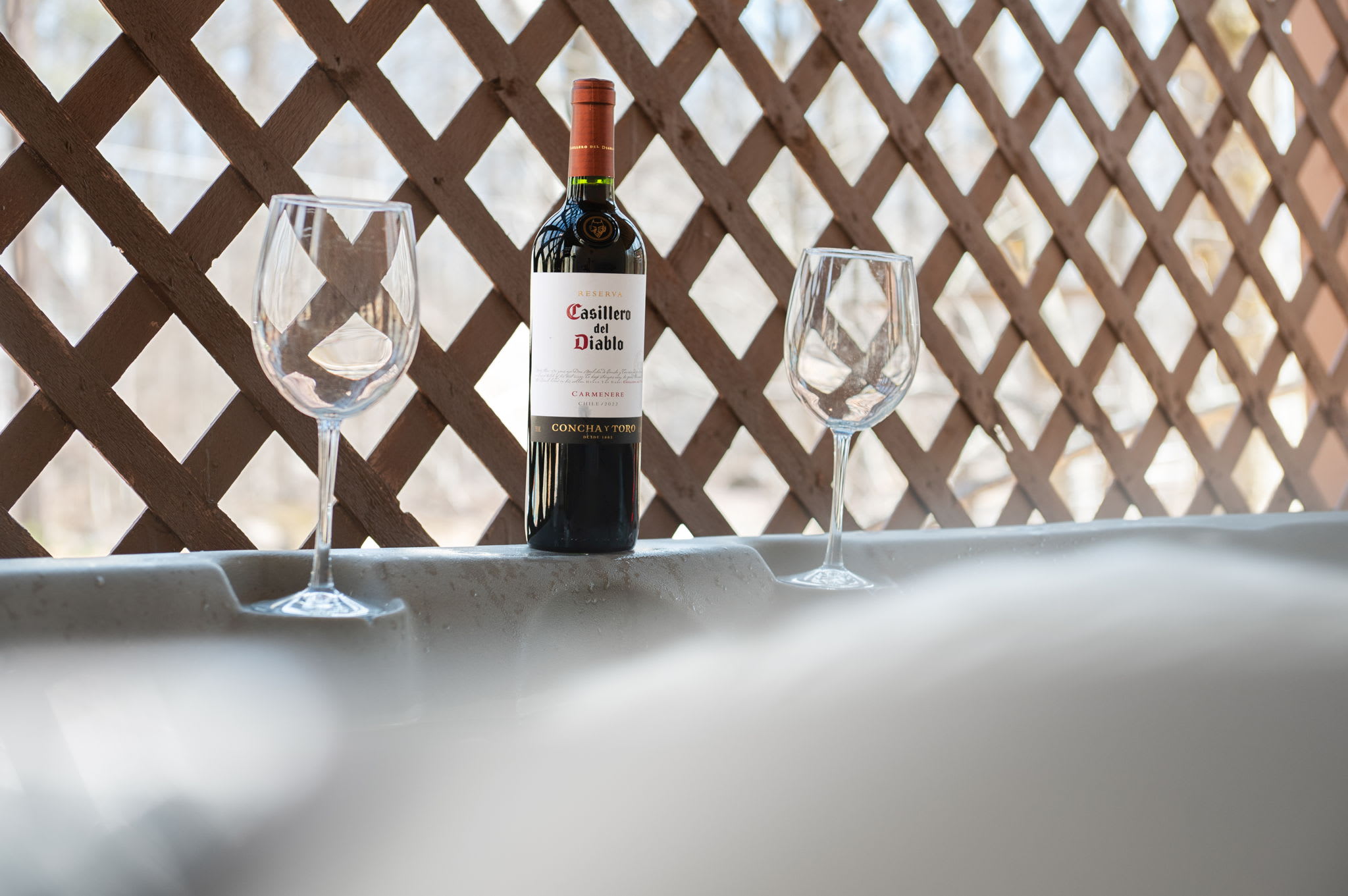 Enjoy a romantic evening with wine by the steaming hot tub on the deck