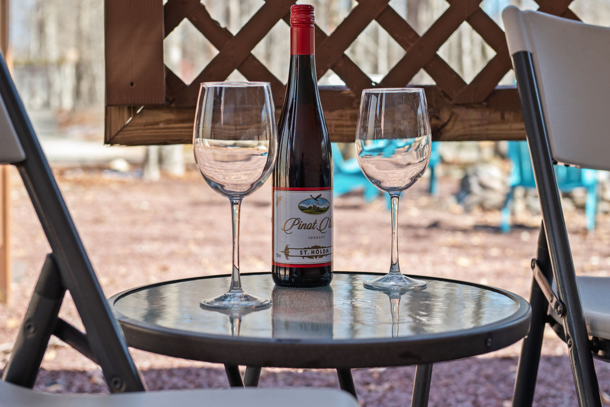 Savor alfresco dining on the deck with bistro seating and serene forest views