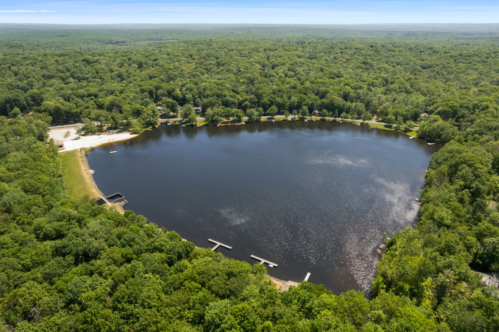 Take in stunning views of pristine Arrowhead Lake surrounded by Pocono mountain forests
