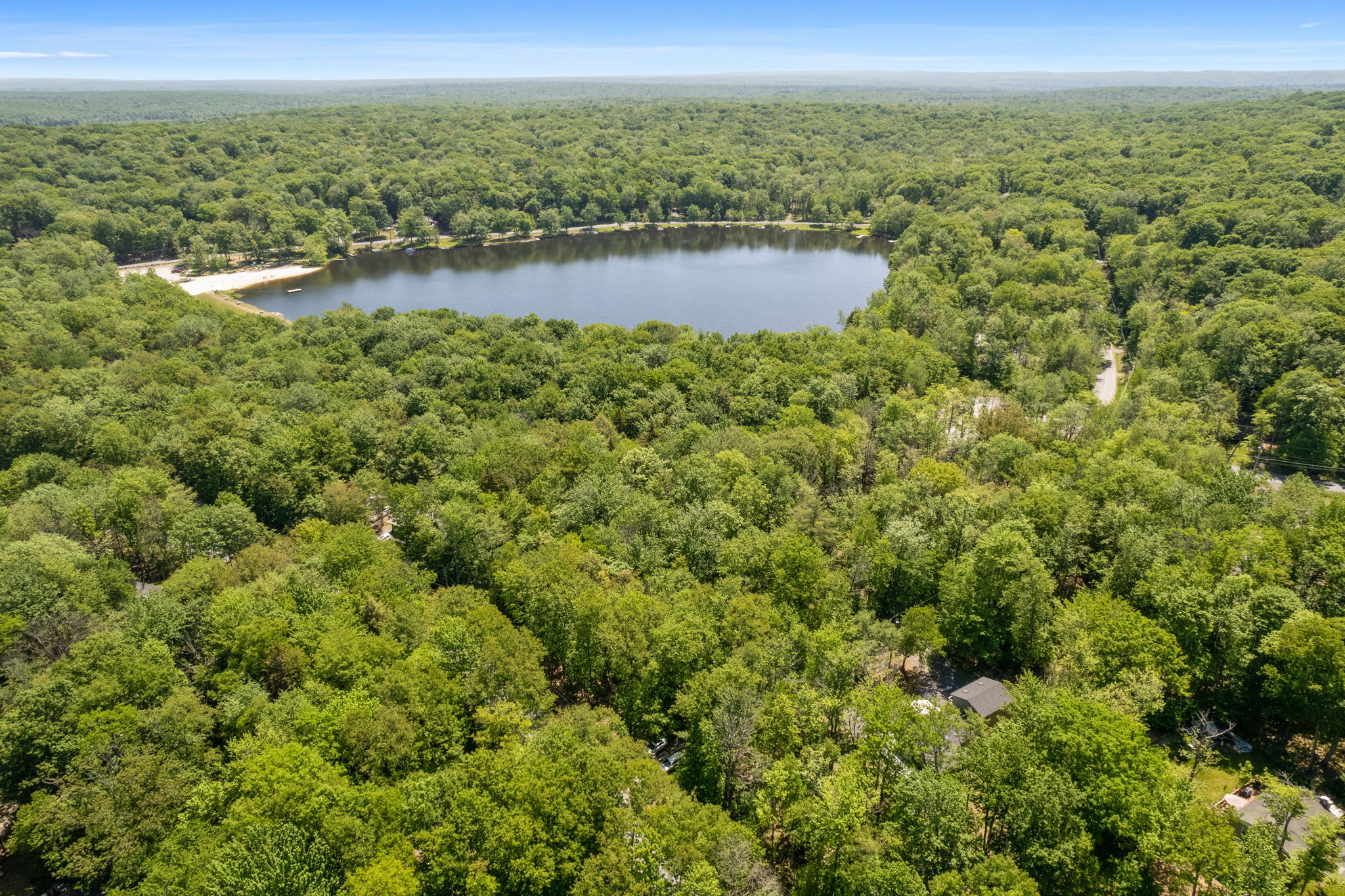 Discover the serene waters and natural beauty of Arrowhead Lake from a bird's eye view