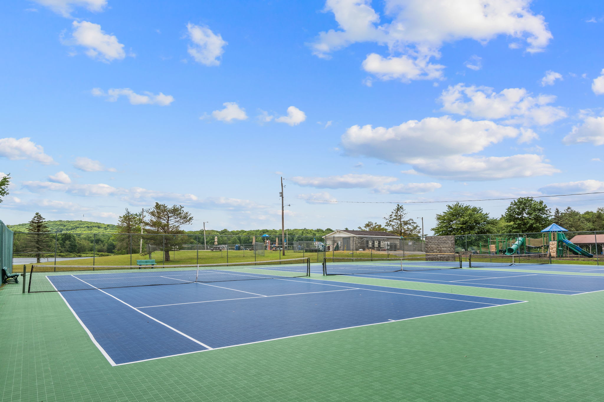 Challenge friends to a match on the community tennis and pickleball courts