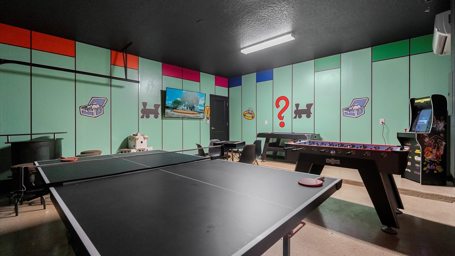 Monopoly themed in-home games room with table tennis, foosball and air-hockey