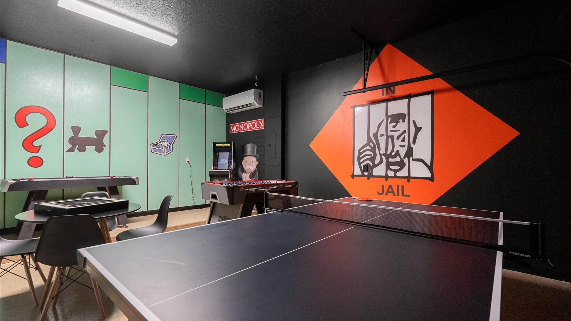 Monopoly themed in-home games room with table tennis and foosball