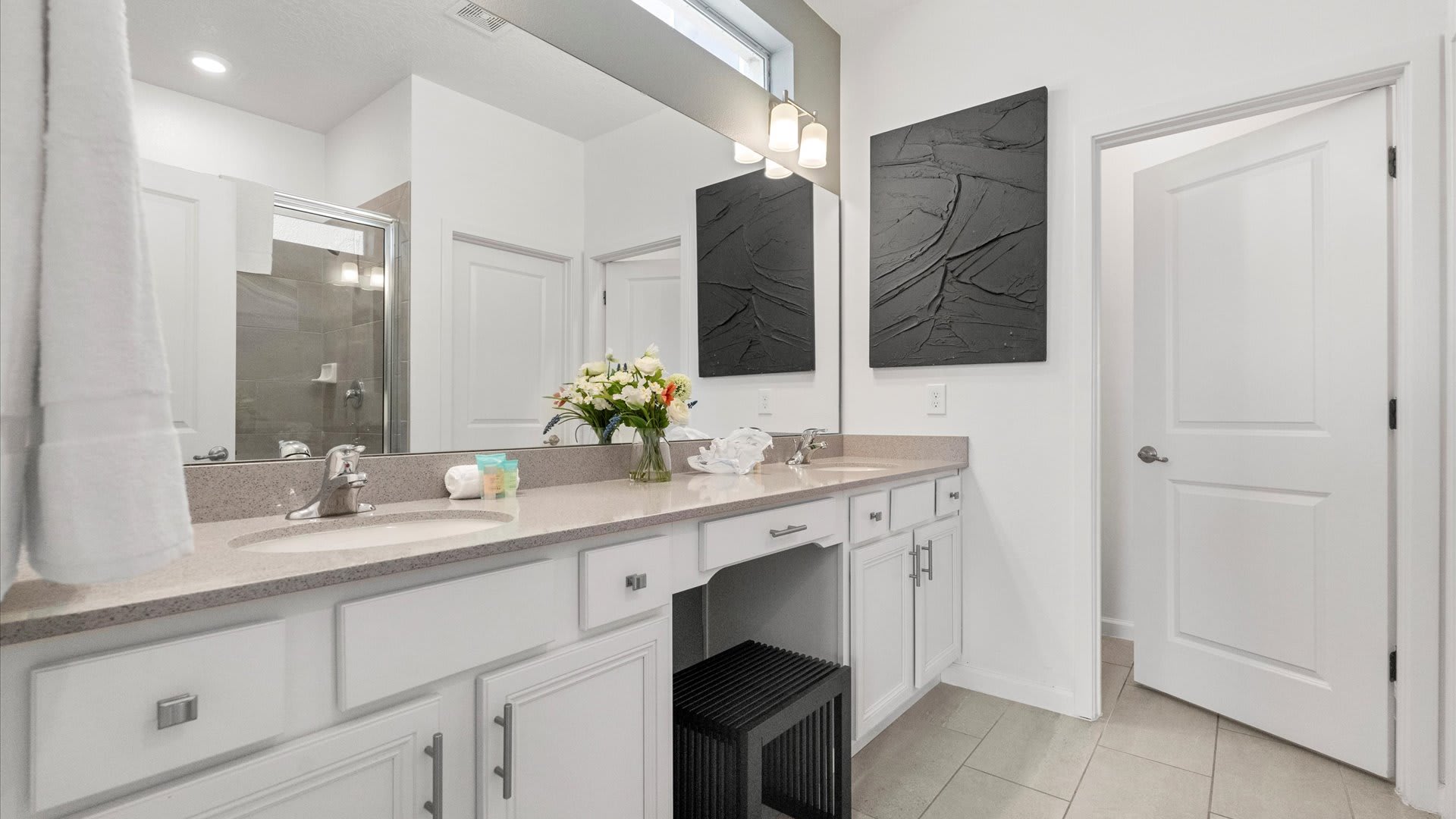 Modern Bathroom Featuring A Spacious Glass-Enclosed Shower And Stylish Fixtures