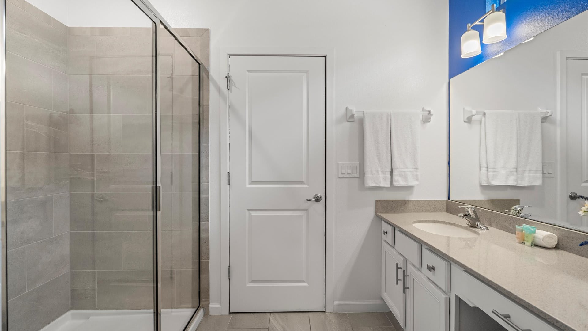Large contemporary en-suite bathroom with double vanity and shower