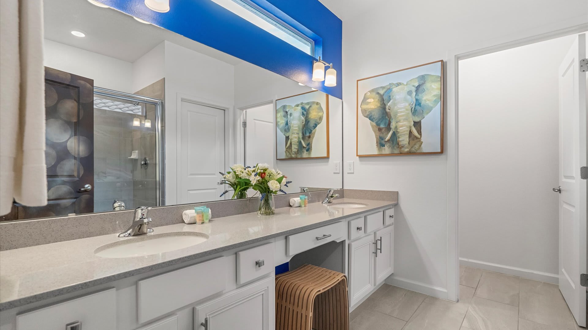 Large contemporary en-suite bathroom with double vanity and shower