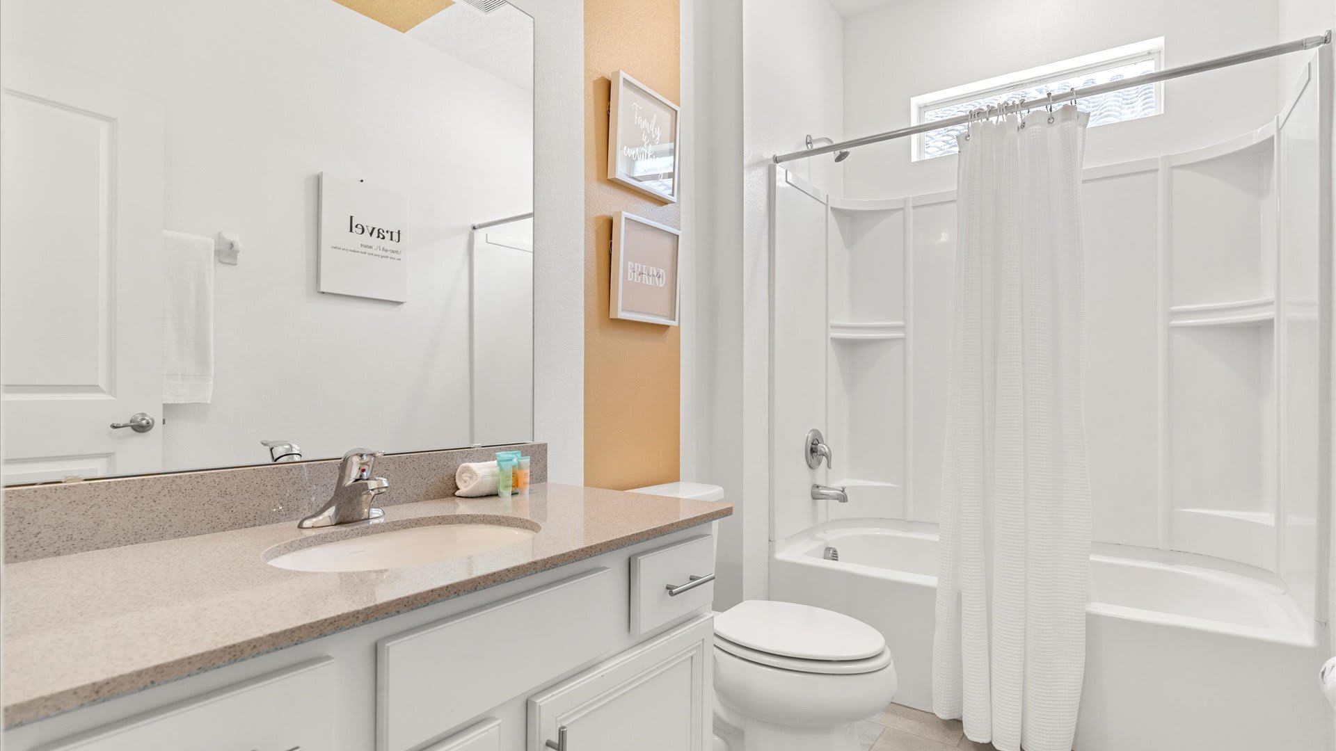 Full modern bathroom with combined bathtub and shower