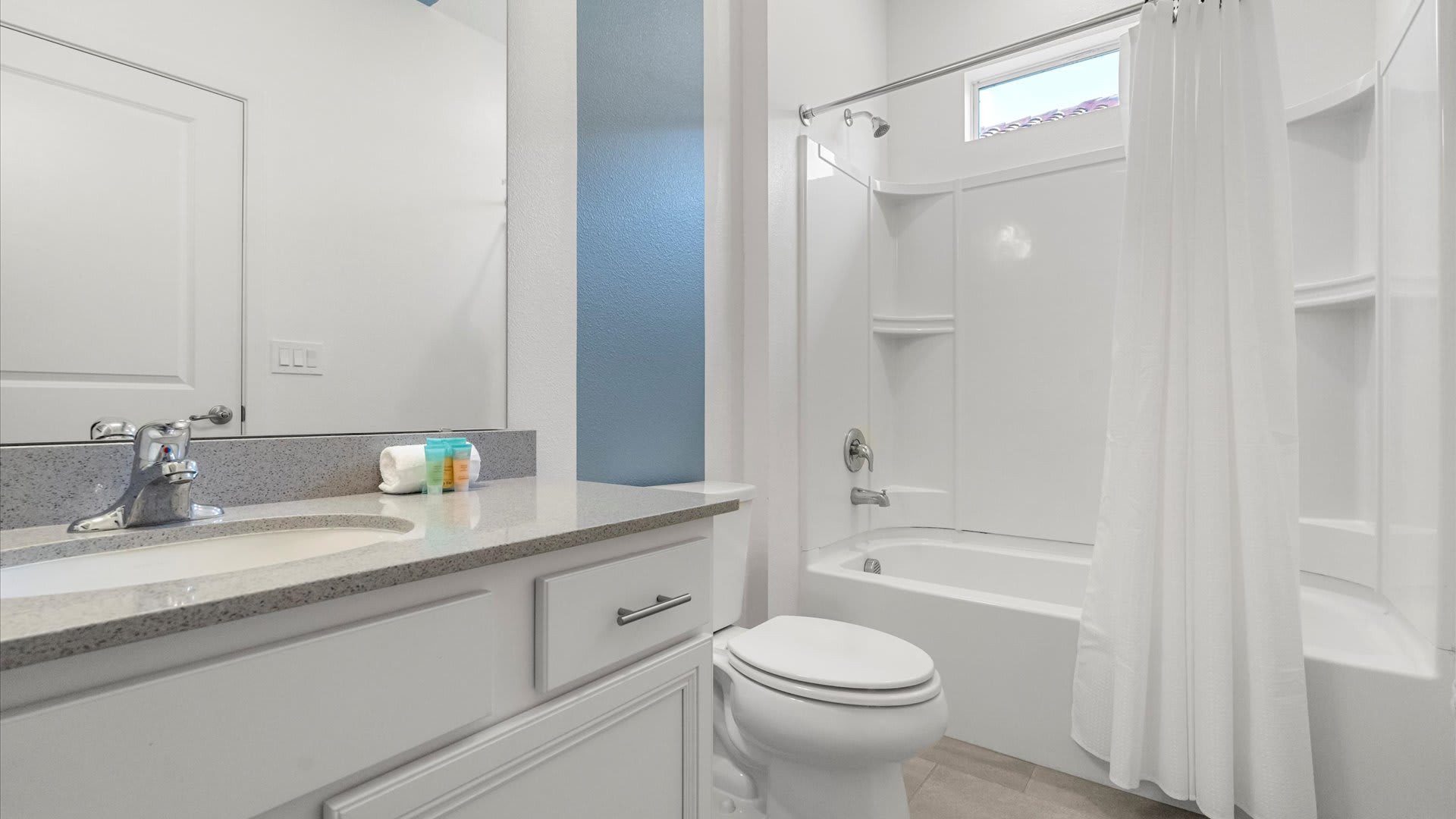 Full modern bathroom with combined bathtub and shower