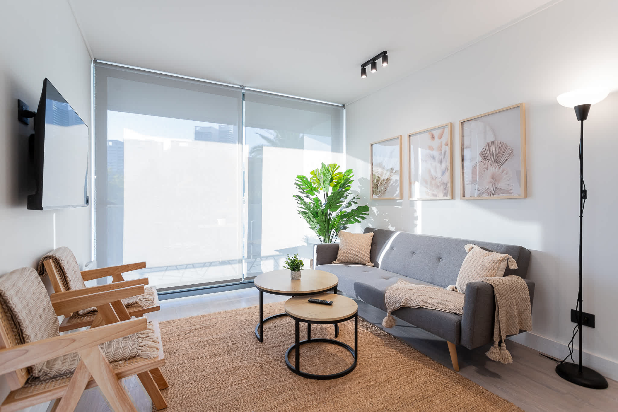 Bright and inviting living room with modern decor, perfect for relaxation and enjoying natural light.
