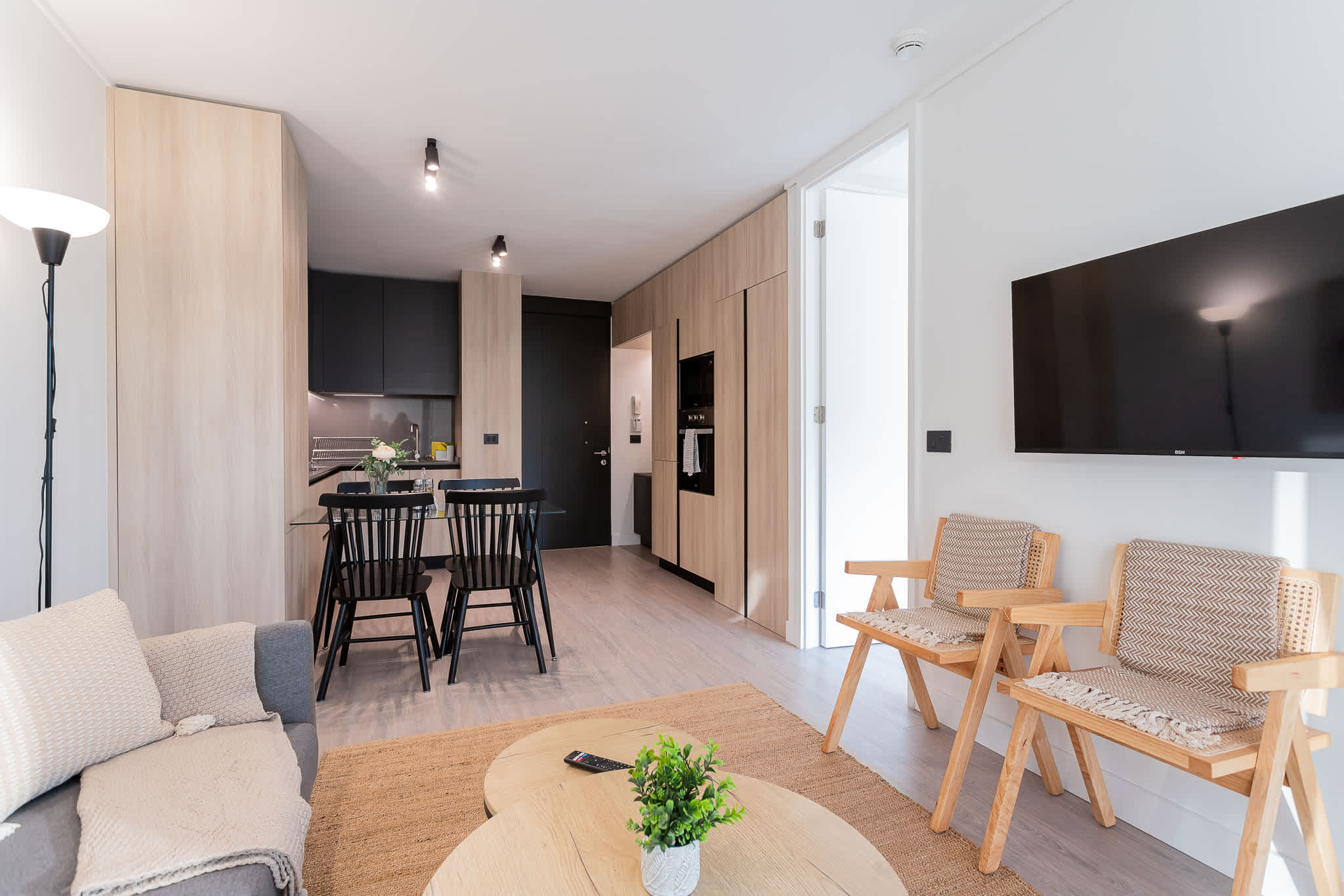 Experience modern comfort in this stylish living space, featuring an open layout and cozy furnishings, perfect for relaxation after a day of adventure.