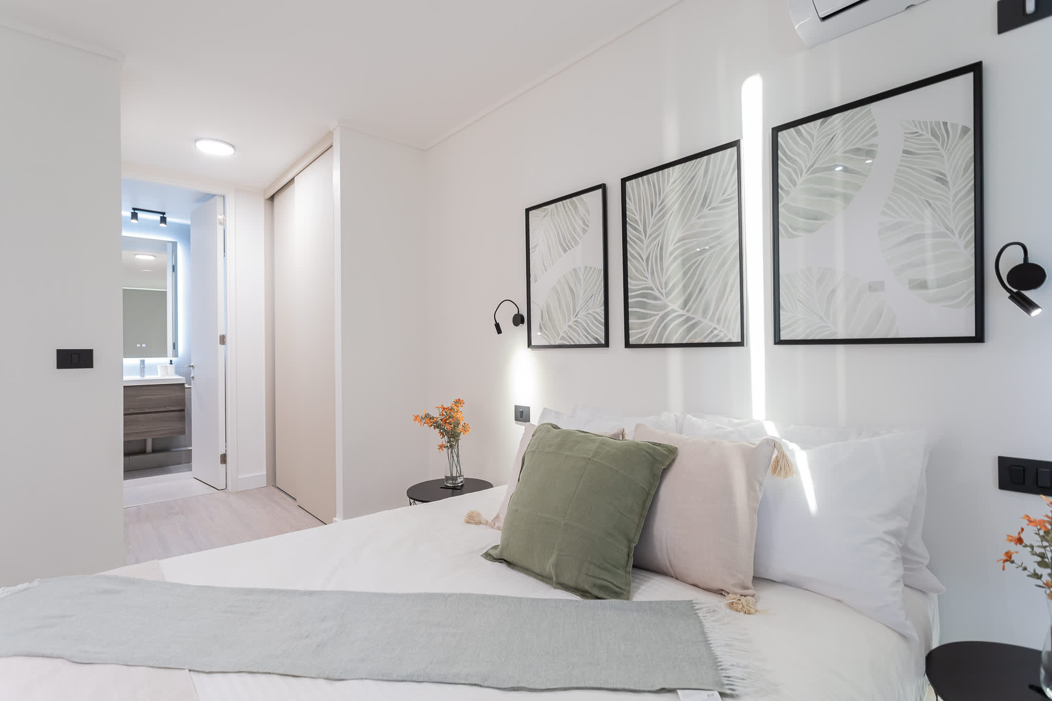 Experience comfort in this stylish bedroom featuring modern decor, cozy bedding, and a serene atmosphere perfect for relaxation.