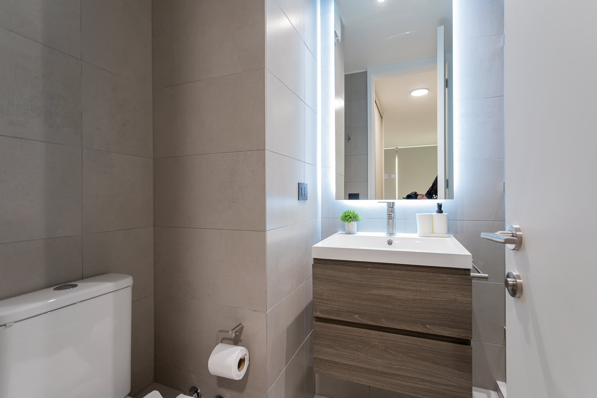 Experience modern comfort in this stylish bathroom, featuring sleek finishes and thoughtful details for a refreshing stay.