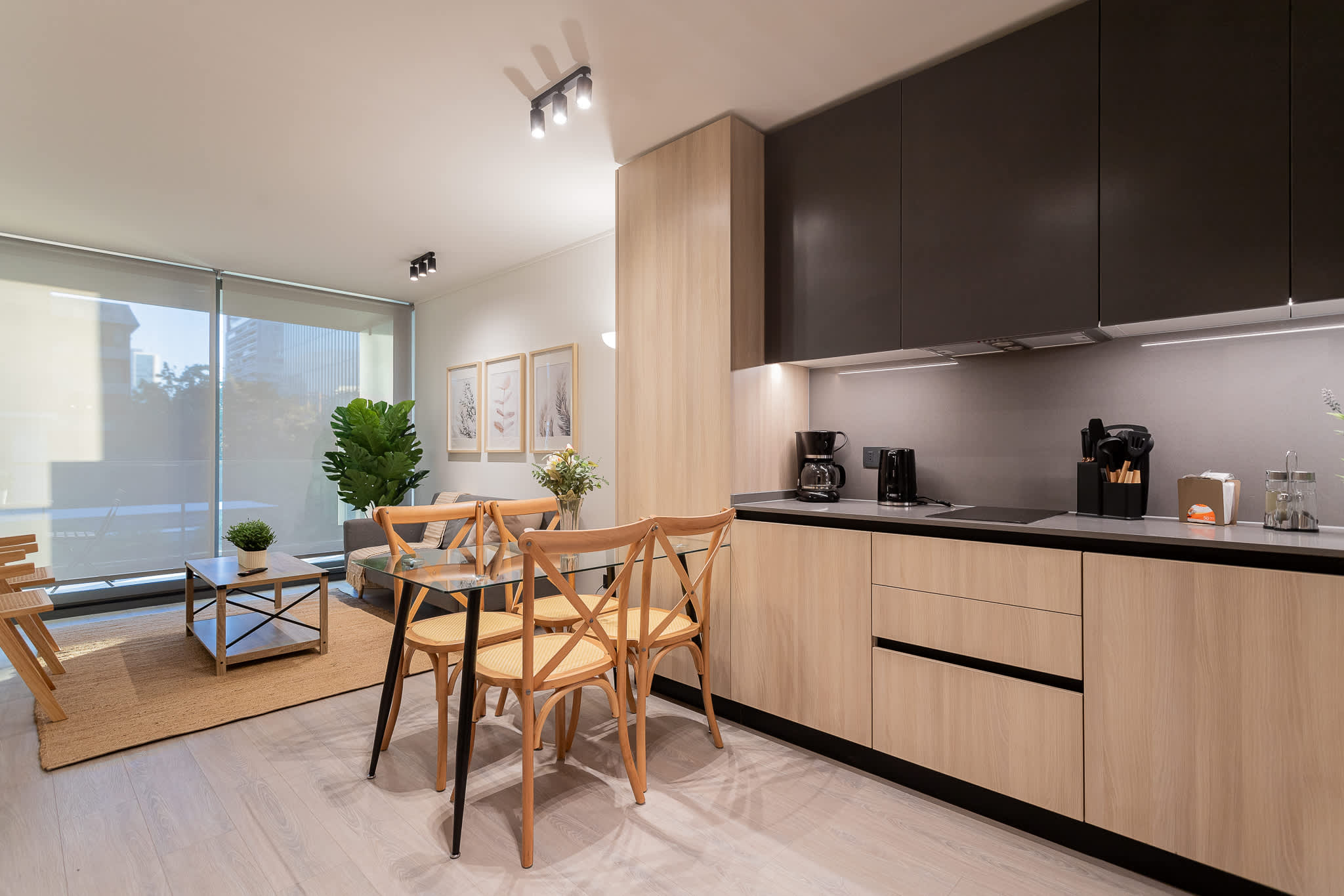Experience modern living in this stylish kitchen and dining area, perfect for meals and gatherings with natural light flooding in.