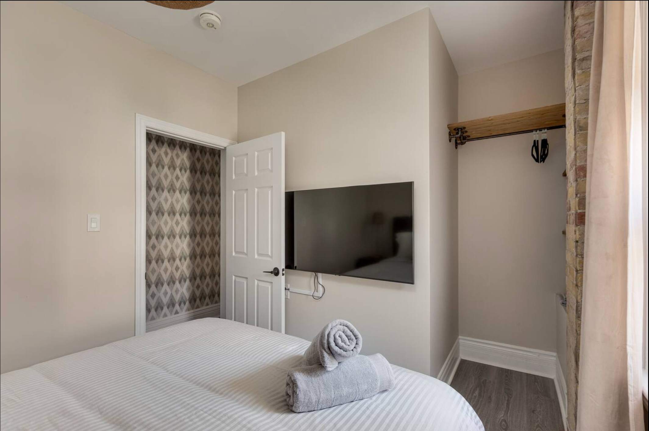Queen bedroom with smart TV