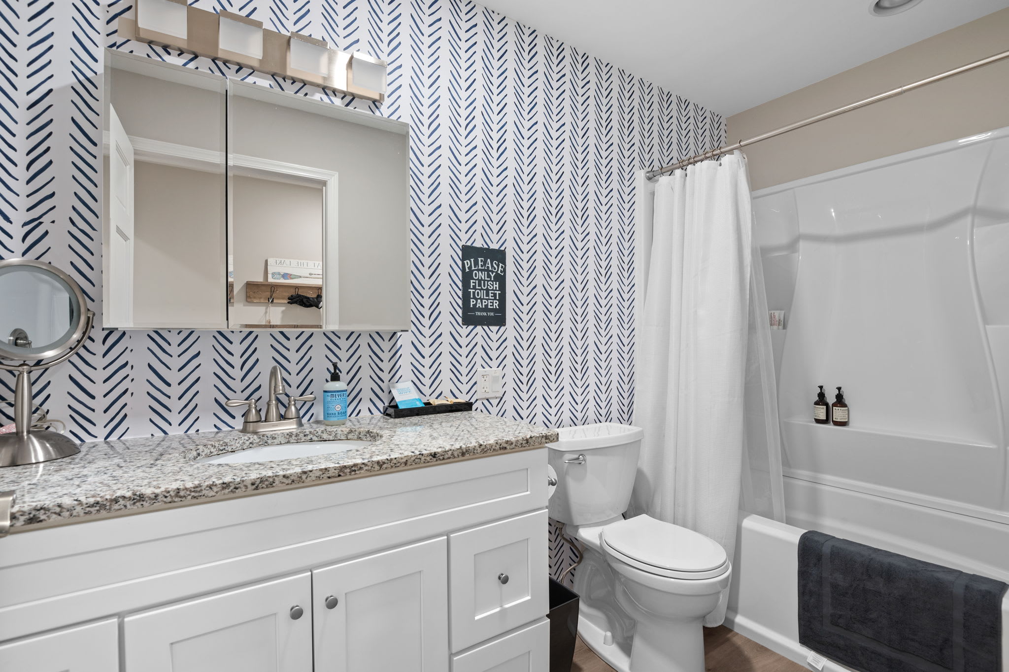 Fresh and Functional Bathroom
Modern tilework and a spacious vanity bring style and practicality to this thoughtfully designed full bathroom.