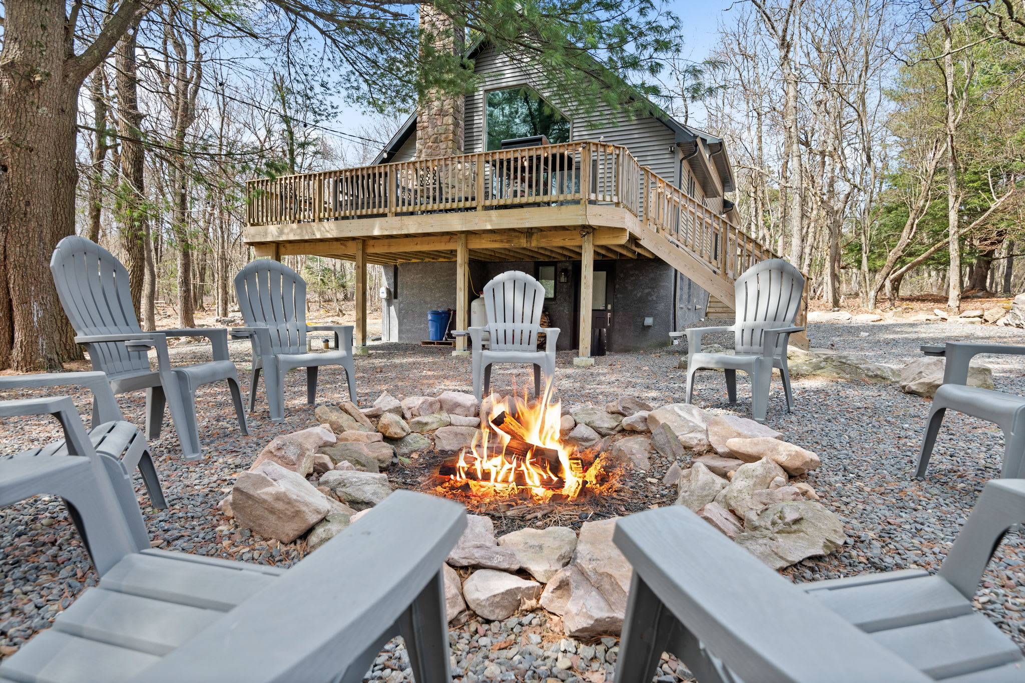 Fireside Memories Await
Gather your group around the fire pit with plenty of seating, surrounded by peaceful woods and starlit skies.