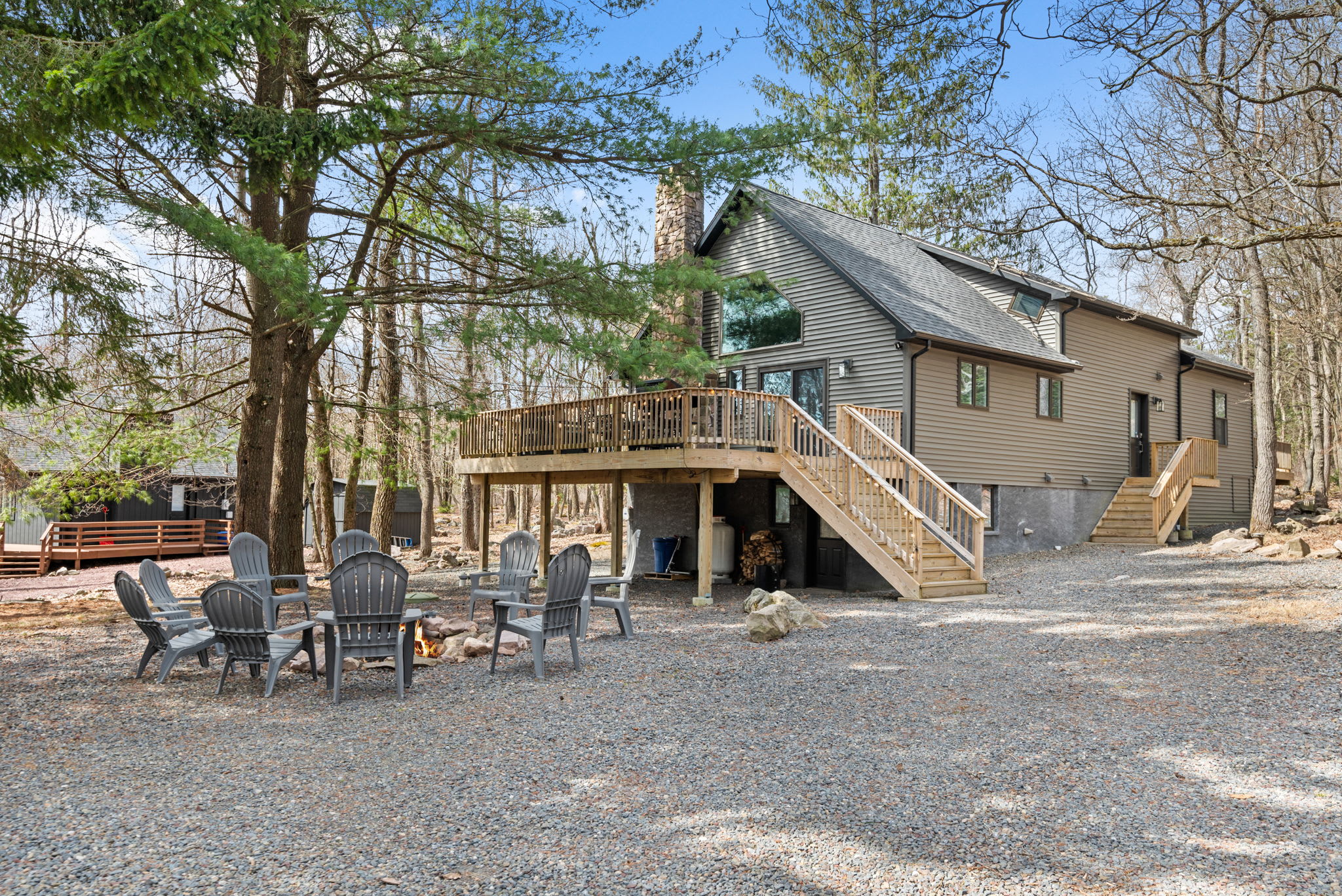 Gather and Connect Outdoors
The fire pit area sits just steps from the home, perfect for evening chats, toasted marshmallows, and starry skies.