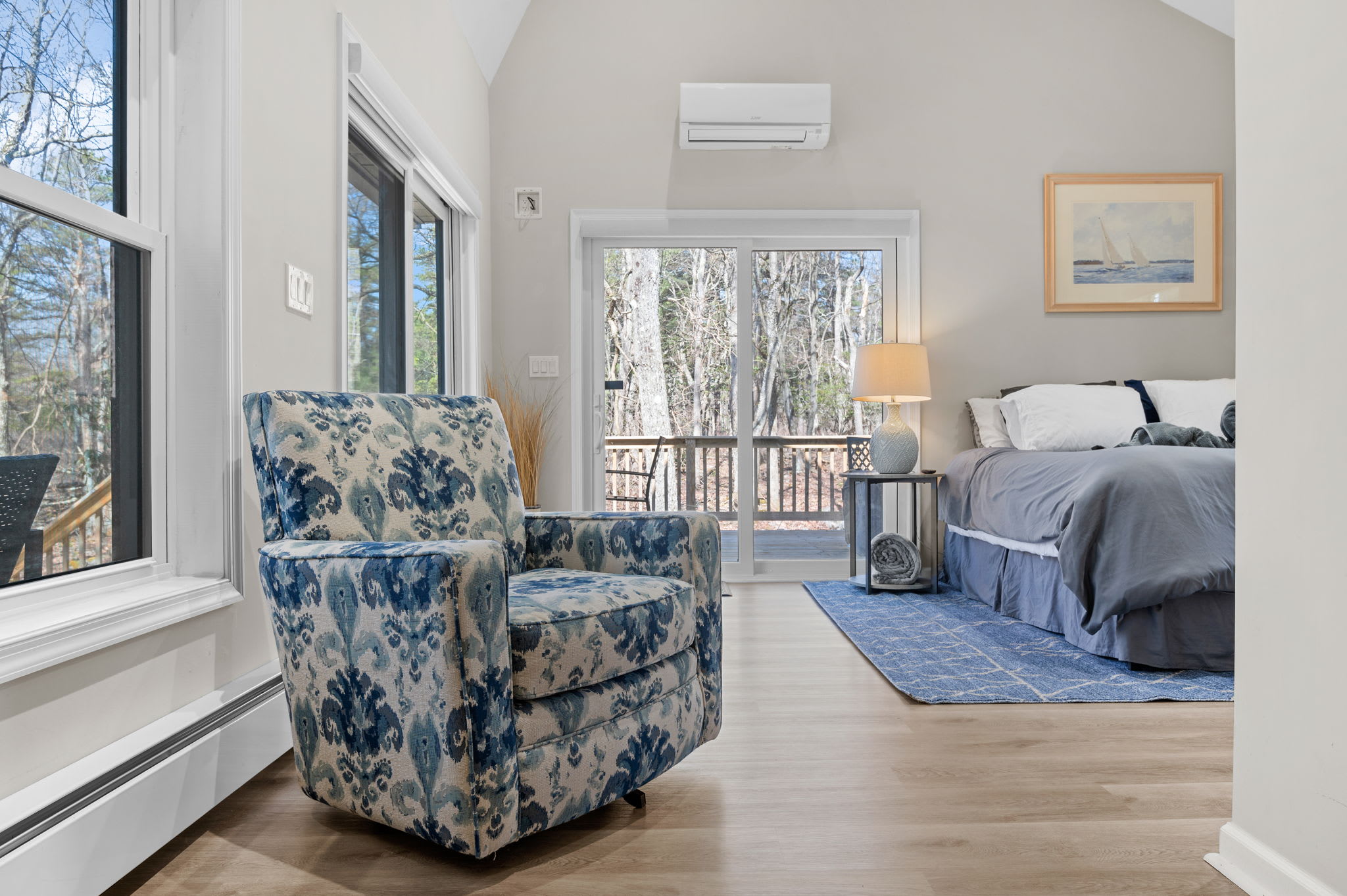 Cozy Corner Views
With windows all around and a comfy chair by your side, this bedroom invites you to unwind in sunlight and style.