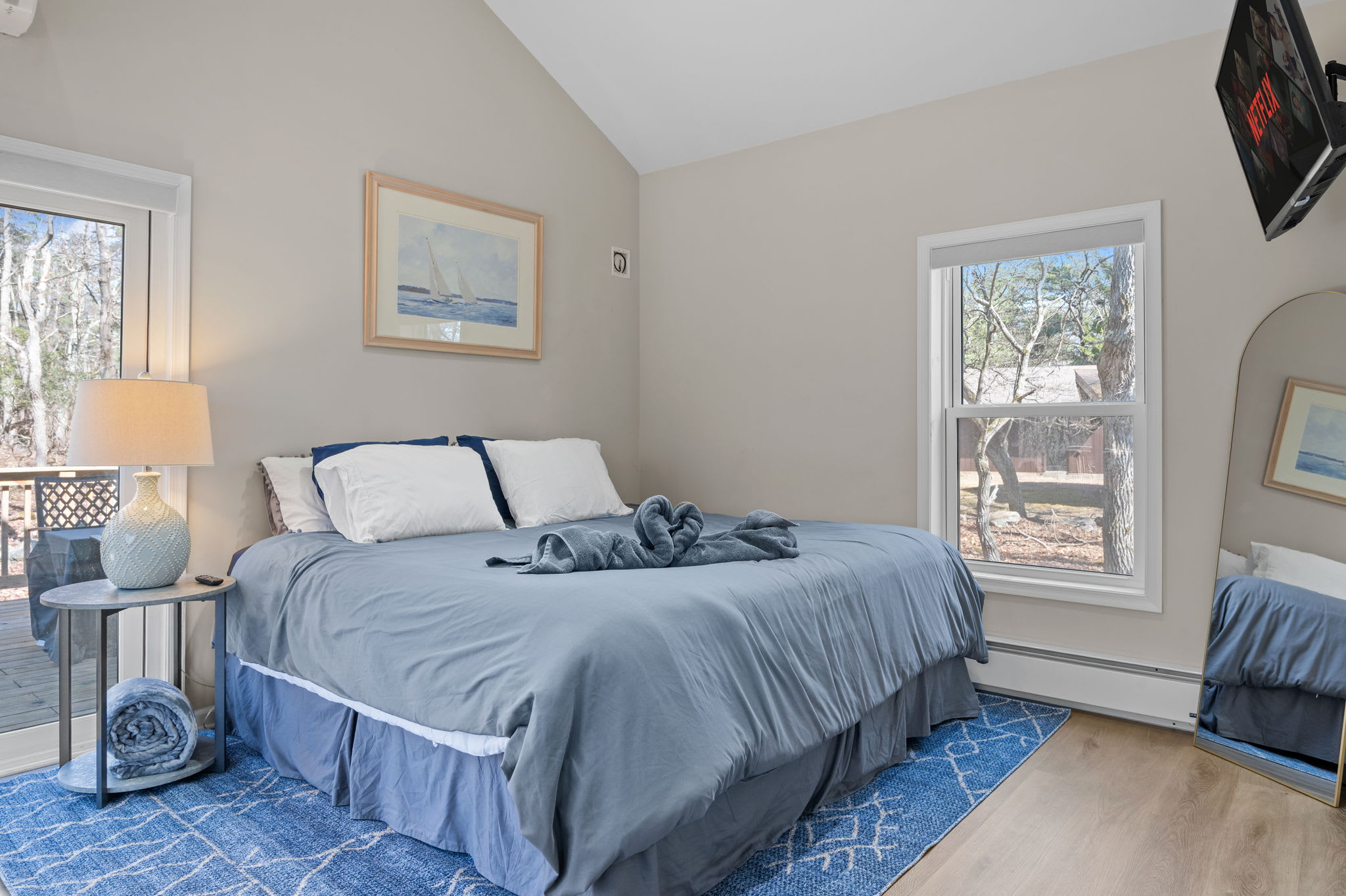 Soft Blue Tones and Natural Light
Peaceful hues, bright windows, and a plush bed make this space the ultimate restful hideaway.