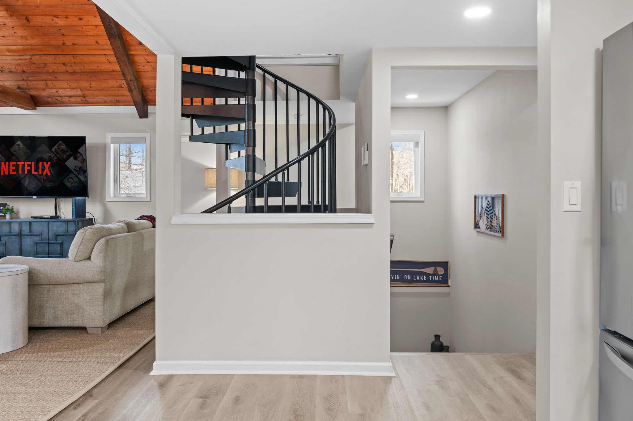 Open Layout and Easy Flow
From the spiral staircase to the living room beyond, this space connects everything with comfort and style.