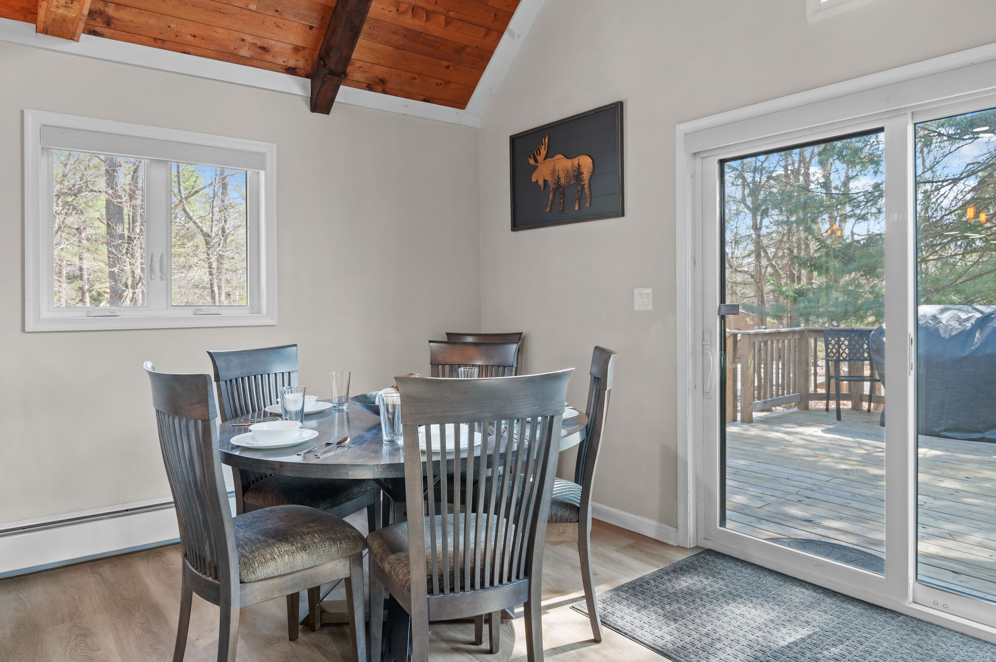 Bright Dining Space
This cheerful spot opens to the deck and offers a cozy corner for meals, games, or morning coffee.