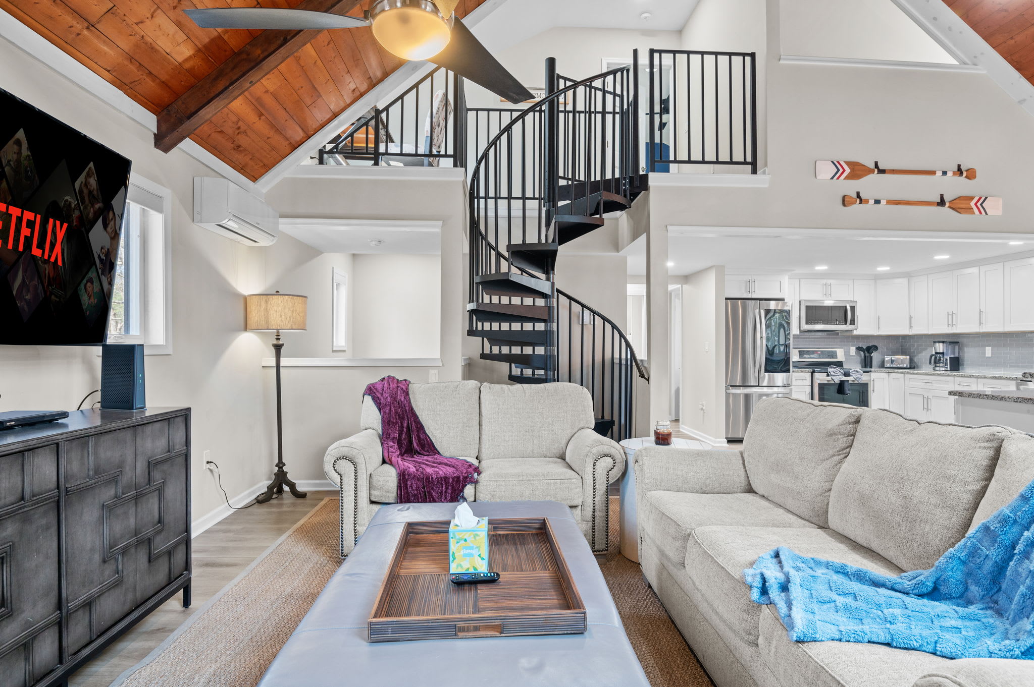 Stylish Living Room Setup
Relax in front of the big screen with cozy throws, soft lighting, and rustic-meets-modern charm.