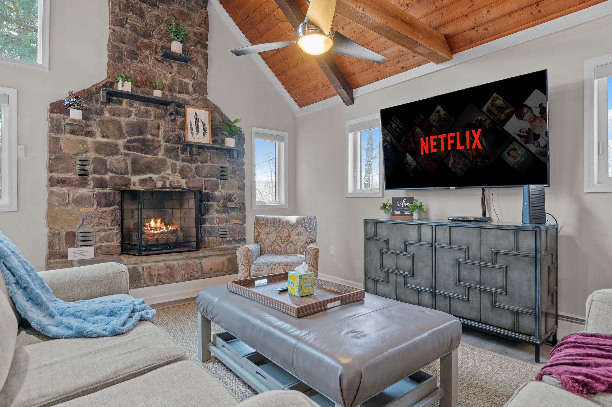 Cozy Fireside Evenings
The heart of the home features a stunning stone fireplace, vaulted ceilings, and the perfect spot for movie nights.