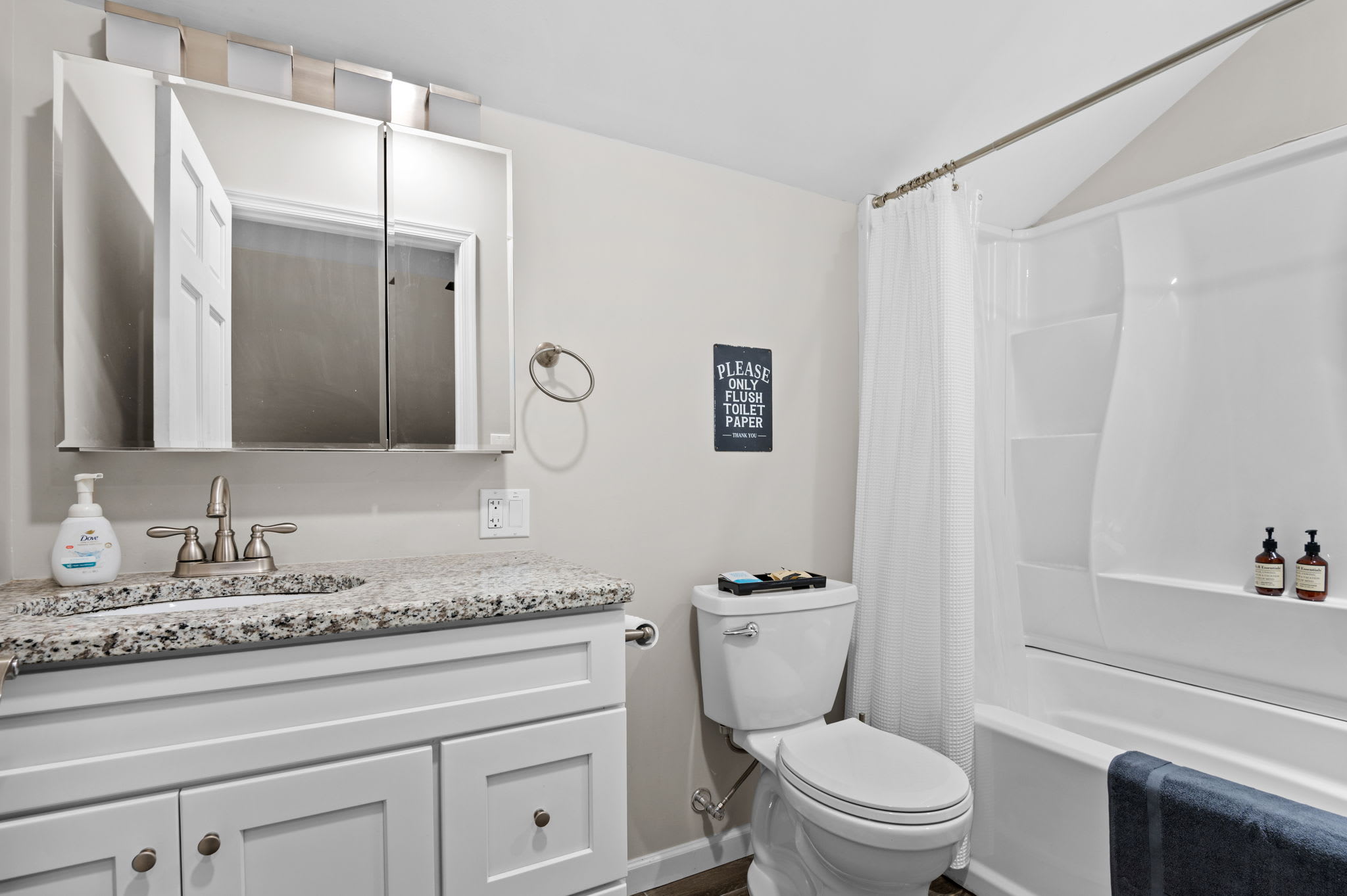 Bright and Polished Bathroom
Clean white finishes and granite counters make this full bath feel both fresh and stylish.