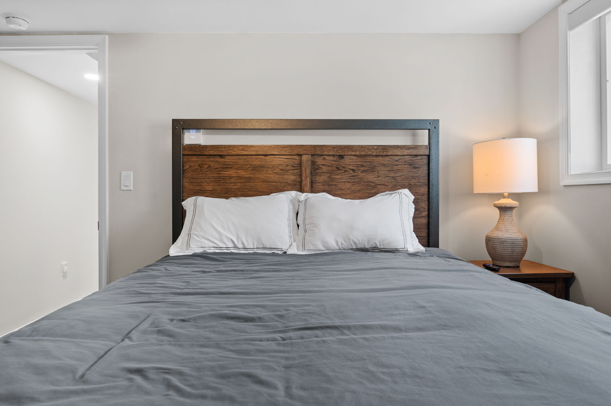 Simple and Comfortable
This clean and cozy bedroom offers soft lighting and a restful space for a great night’s sleep.