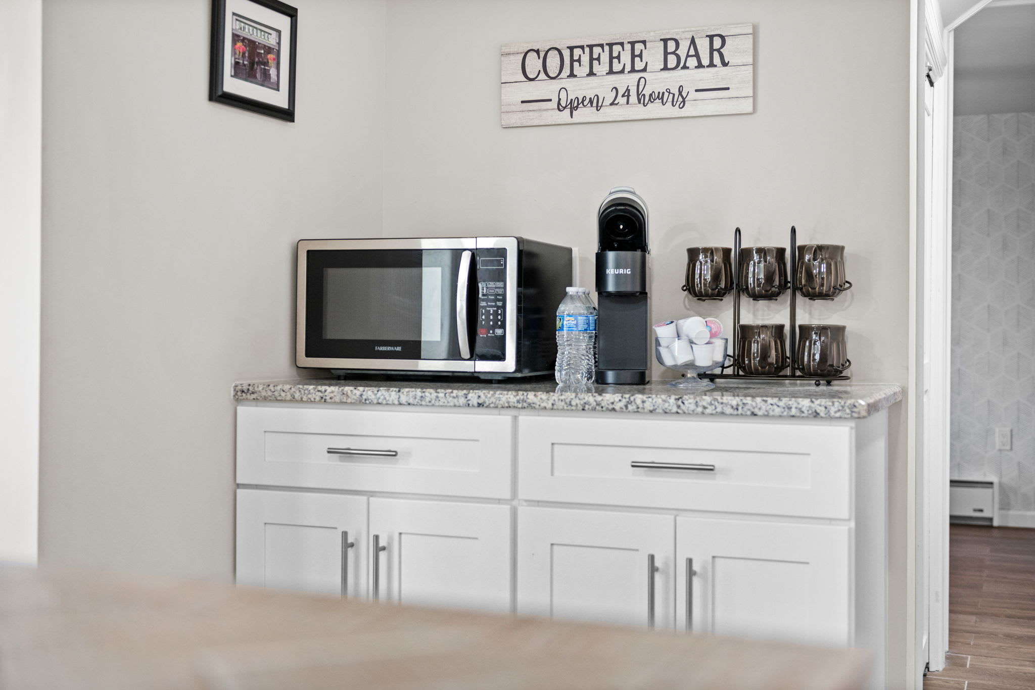 Everything You Need, Right Here
Microwave, coffee, and breakfast essentials are just steps from the hallway, making mornings easy and efficient.