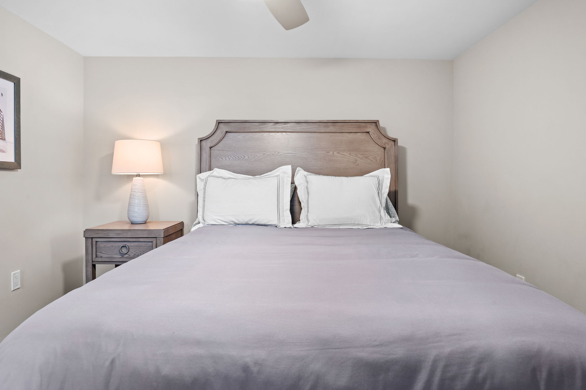 Cozy and Inviting
Plush pillows, wood accents, and warm lighting make this bedroom feel just like home.