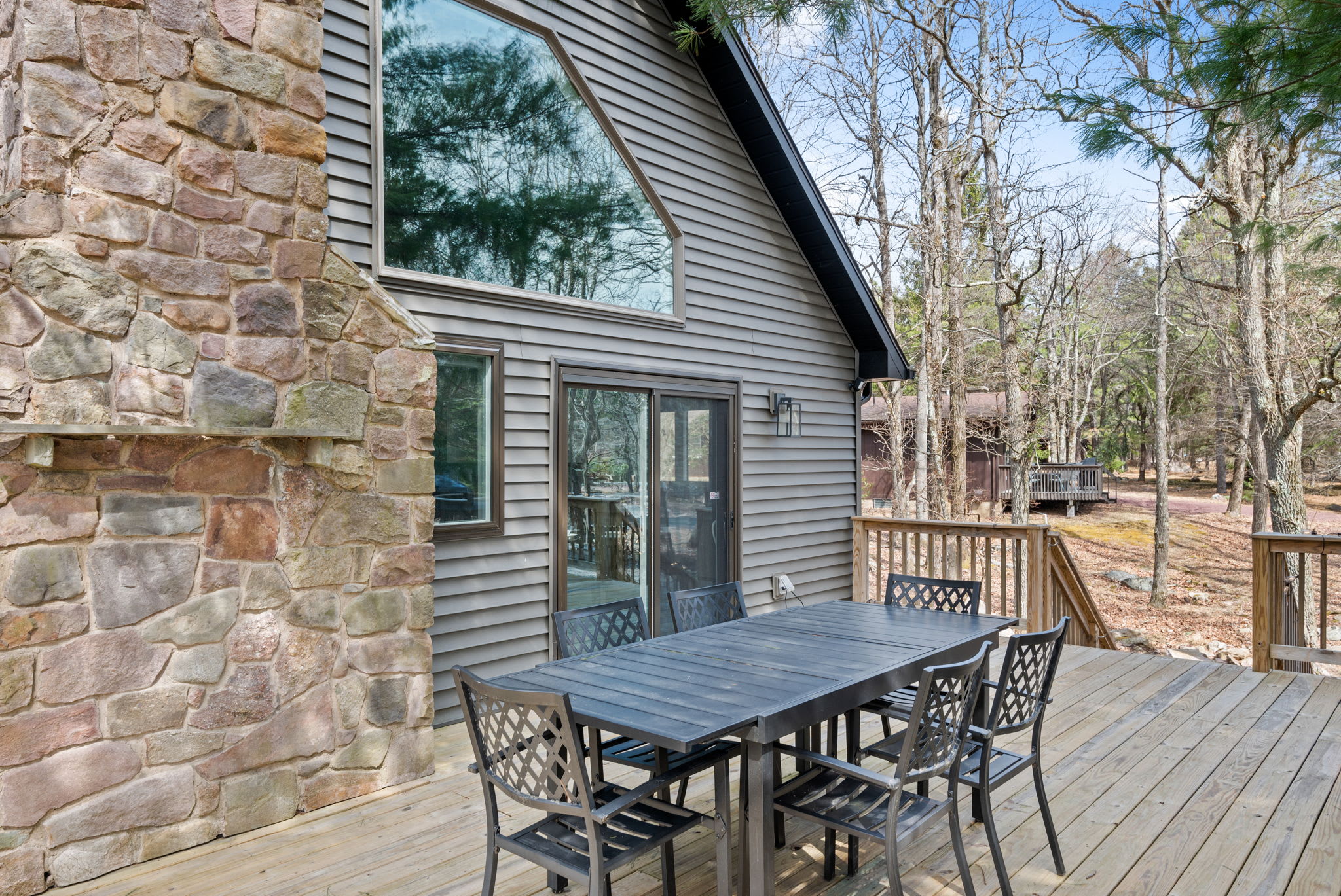 Grill and Dine Outdoors
Enjoy alfresco meals on this spacious deck with forest views and a grill ready for action.