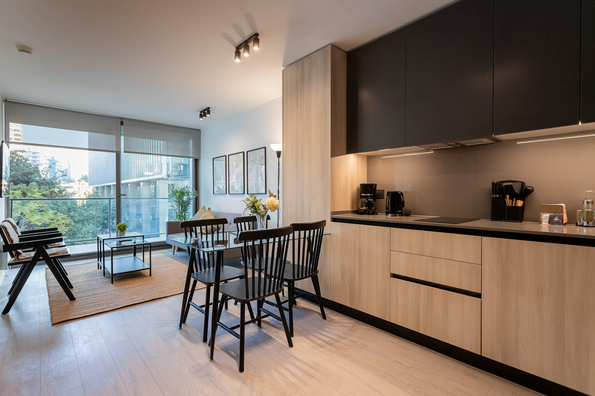 Bright and modern living space with large windows, perfect for relaxation and enjoying the view. Ideal for your next getaway!