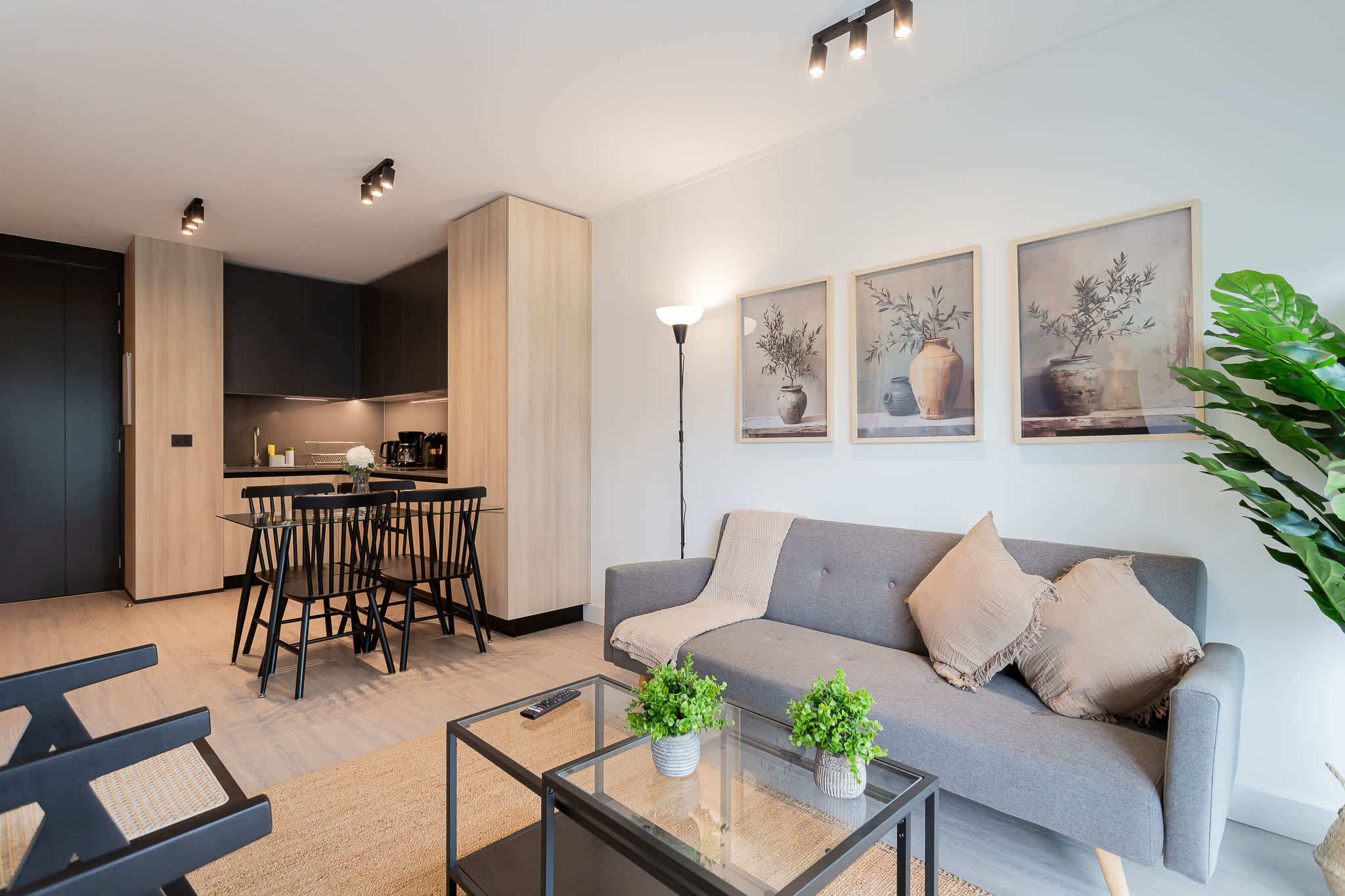 Experience modern comfort in this stylish living space, featuring elegant decor and a cozy atmosphere perfect for relaxation.