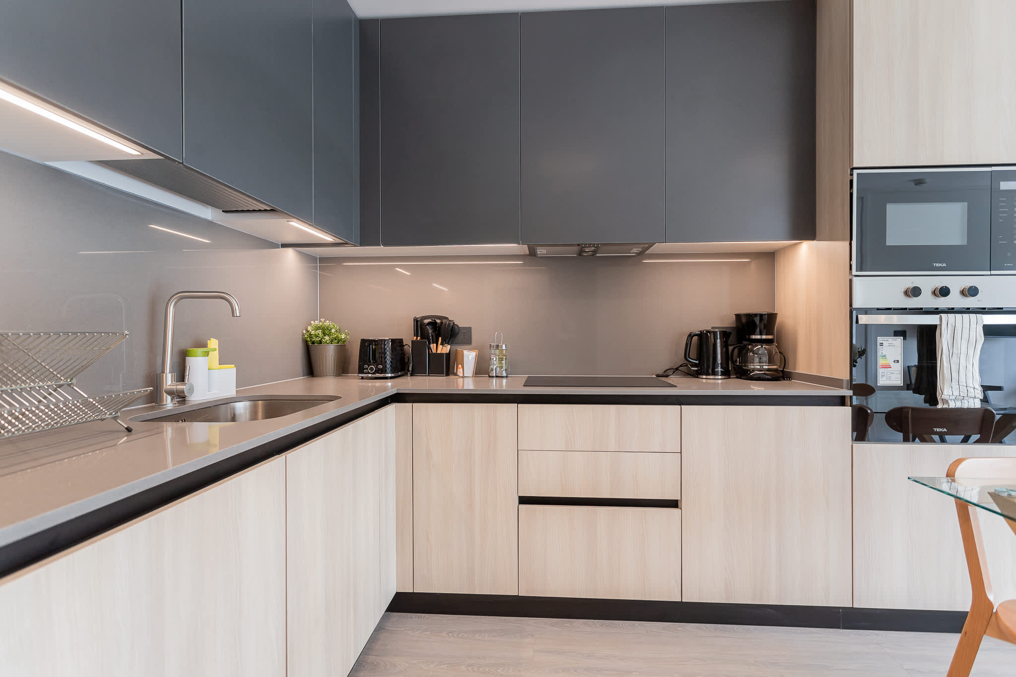 Experience a sleek, modern kitchen equipped with everything you need for your culinary adventures!